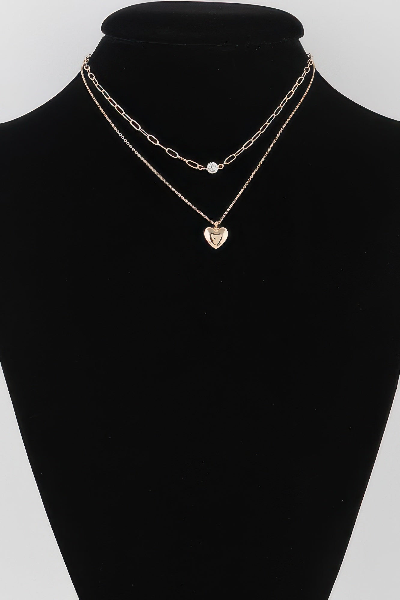 Gold double-heart chain necklace: small clear-stone heart & large heart pendant