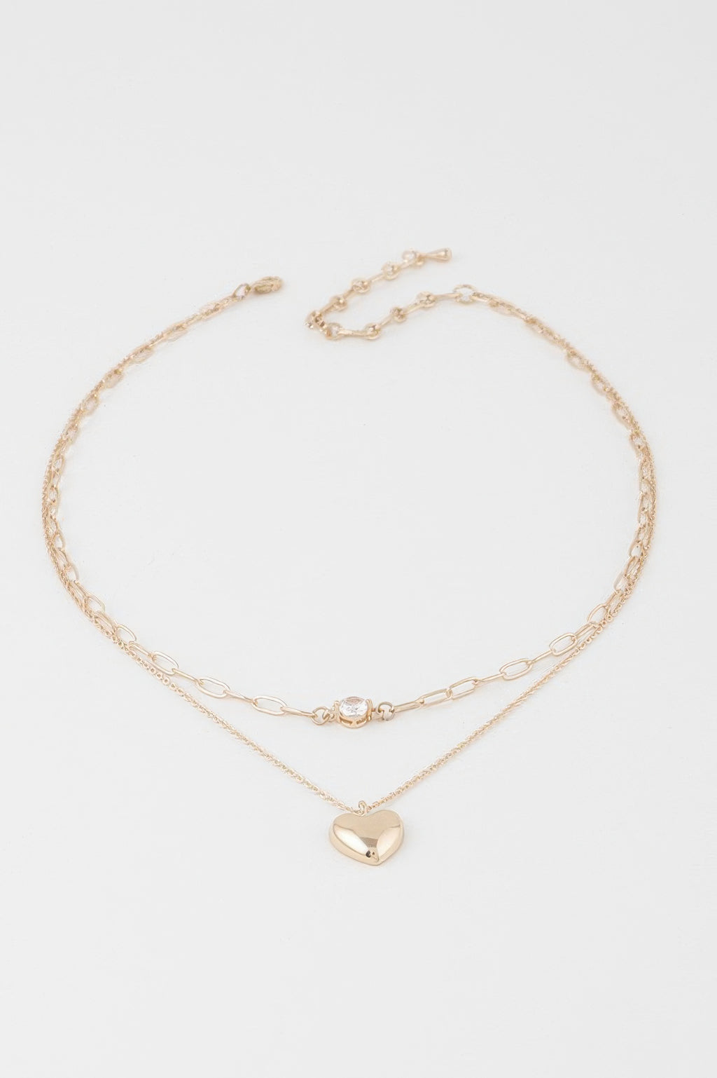 Double-heart chain necklace with layered gold chains and small clear heart clasp, heart pendant