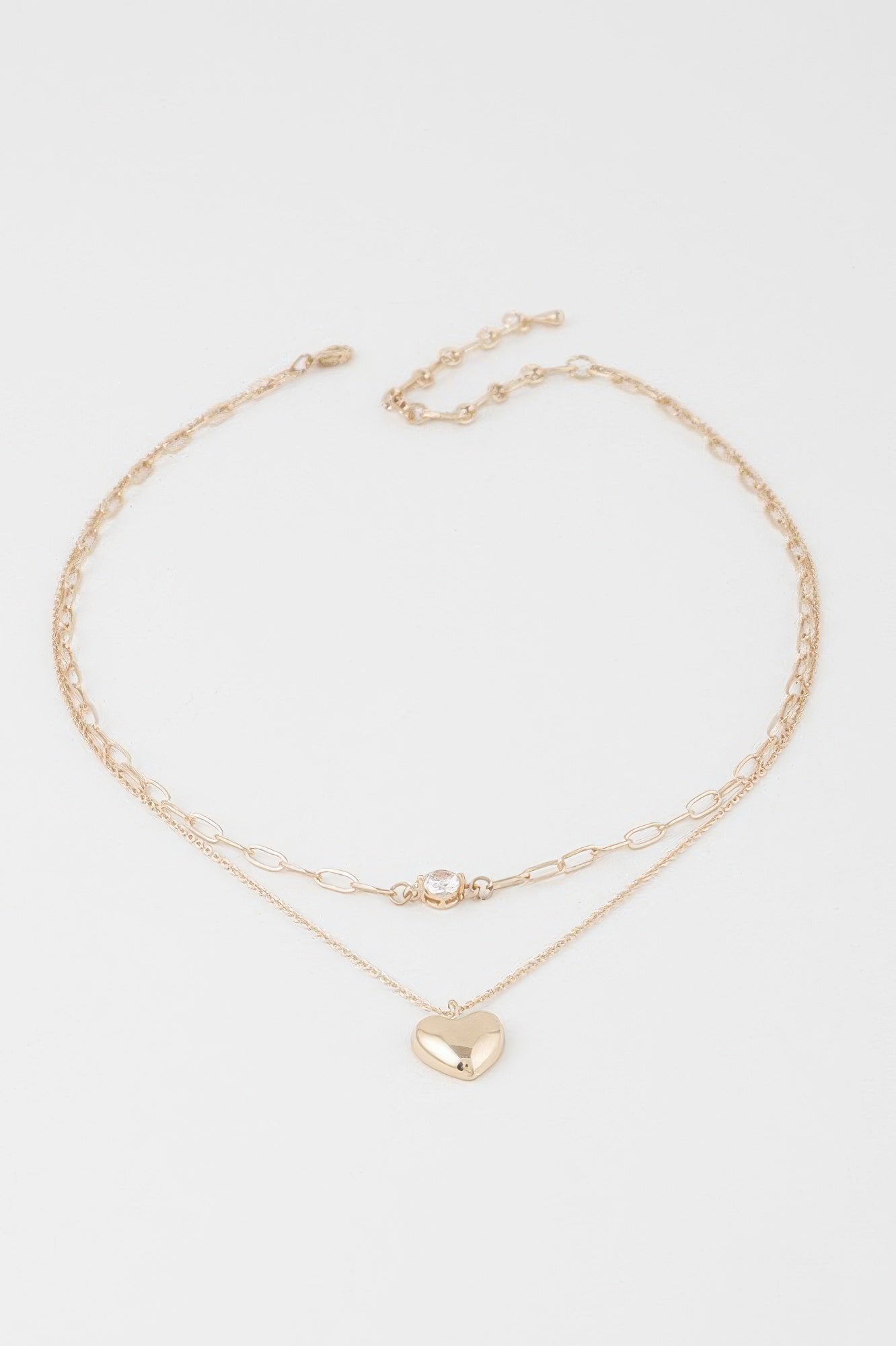 Double-heart chain necklace with layered gold chains and small clear heart clasp, heart pendant