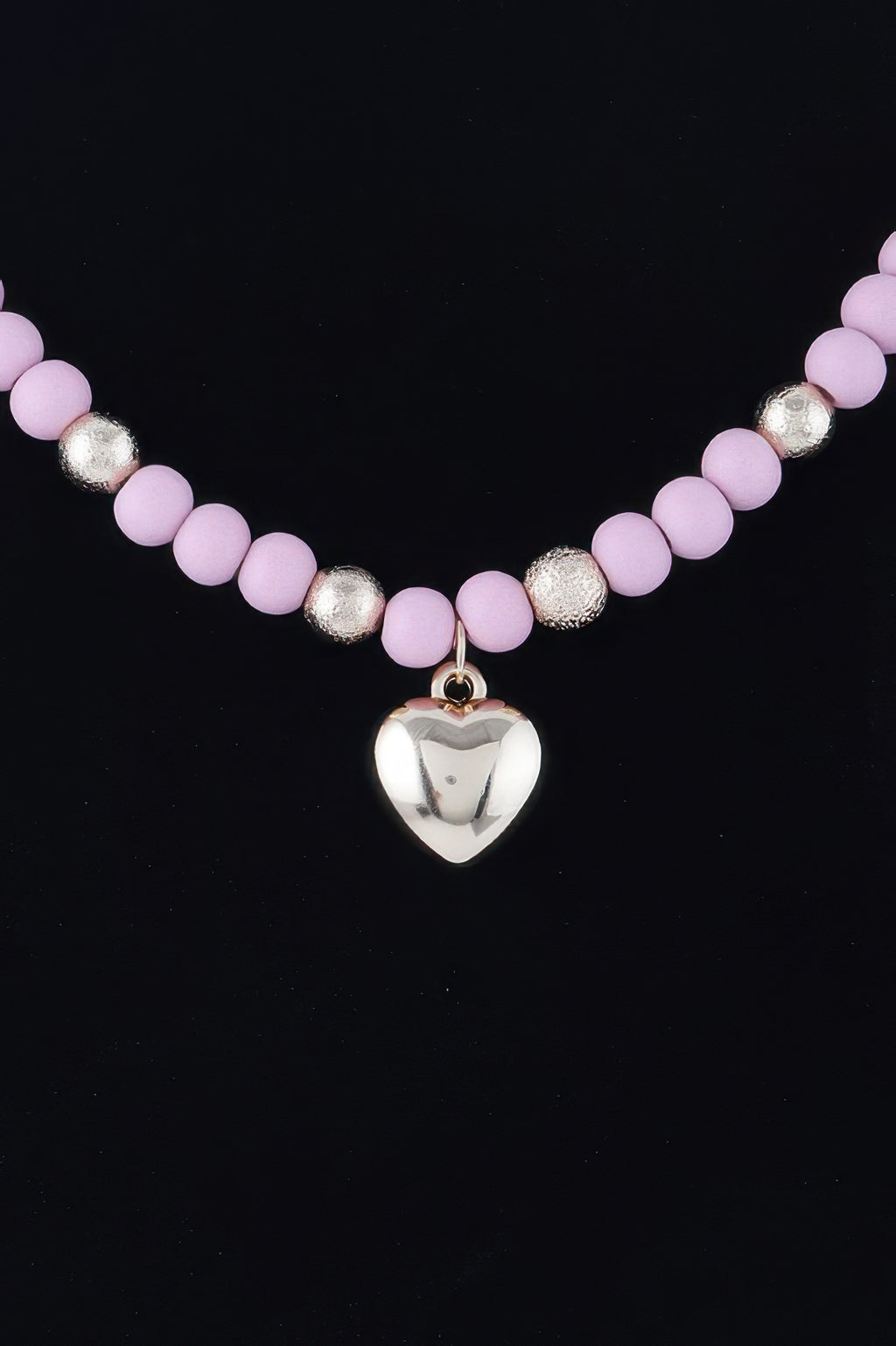 Pink bead necklace with metallic spacers and small heart charm pendant