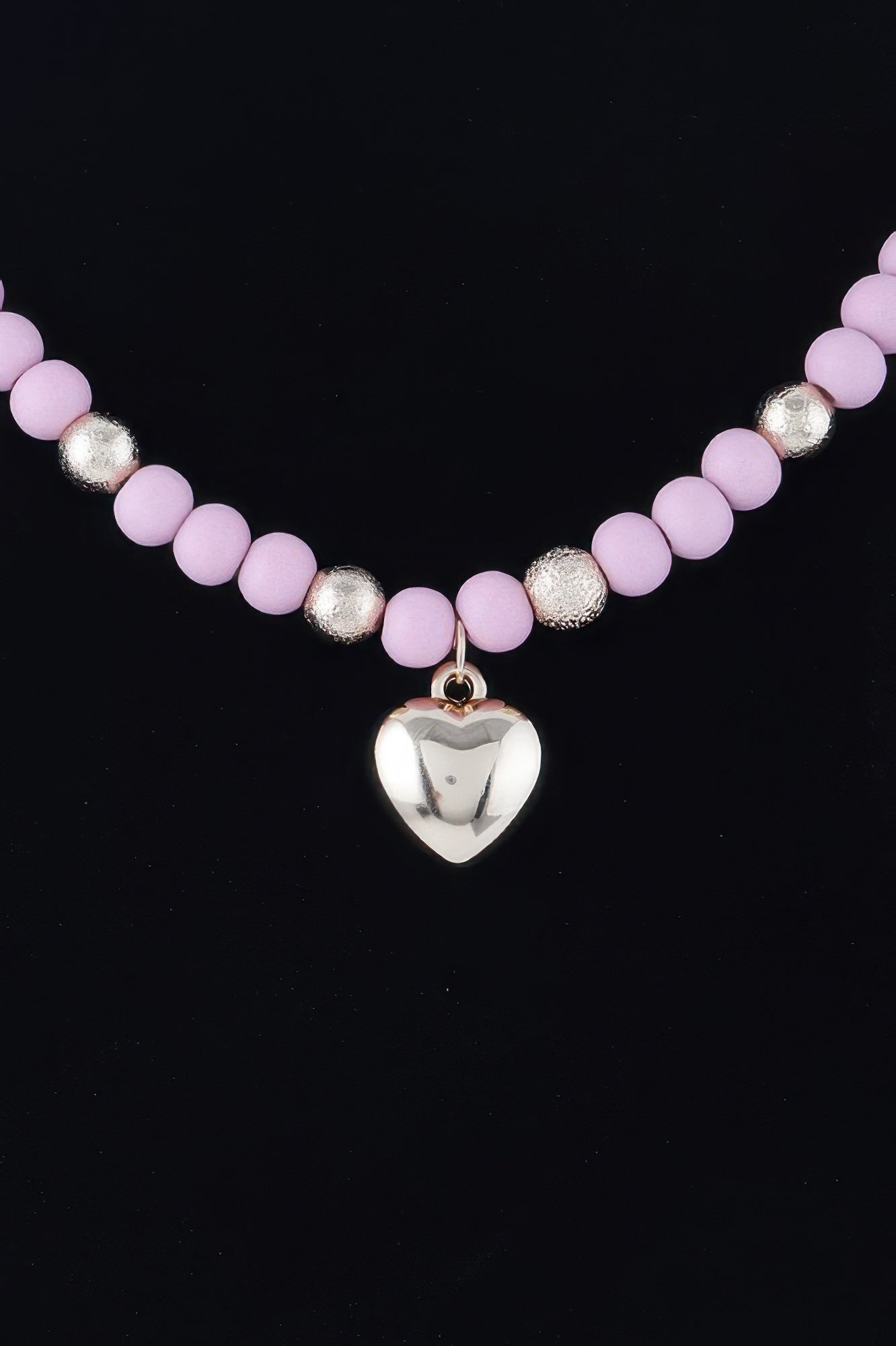 Pink bead necklace with metallic spacers and small heart charm pendant