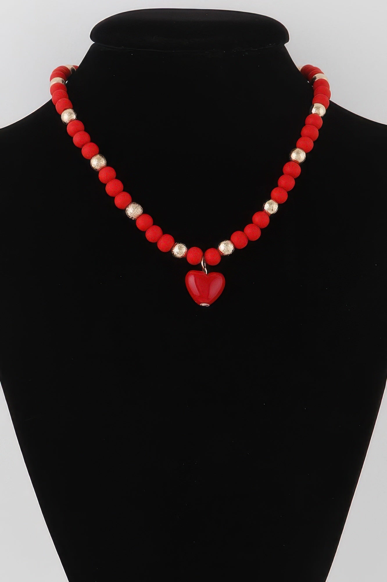 Red beaded heart necklace with gold-tone spacers and red heart pendant