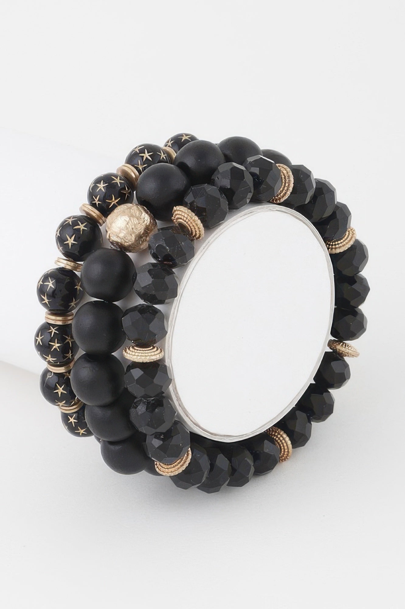 Triple Star beaded bracelet in black with star-pattern accents and faceted beads