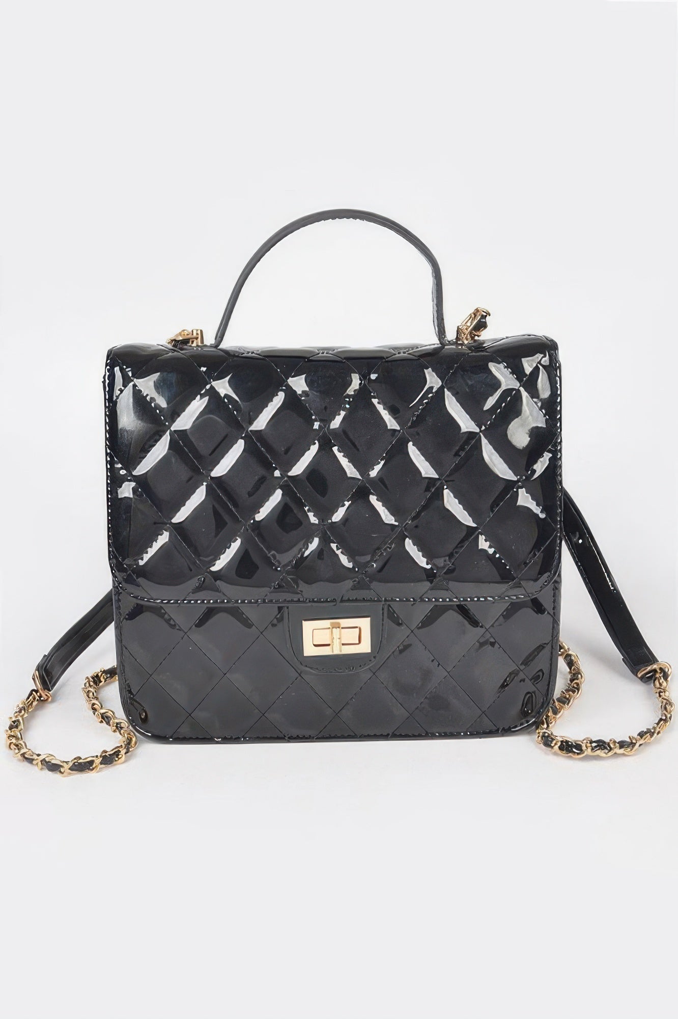Quilted enamel backpack, black with glossy diamond pattern and top handle, gold-tone clasp