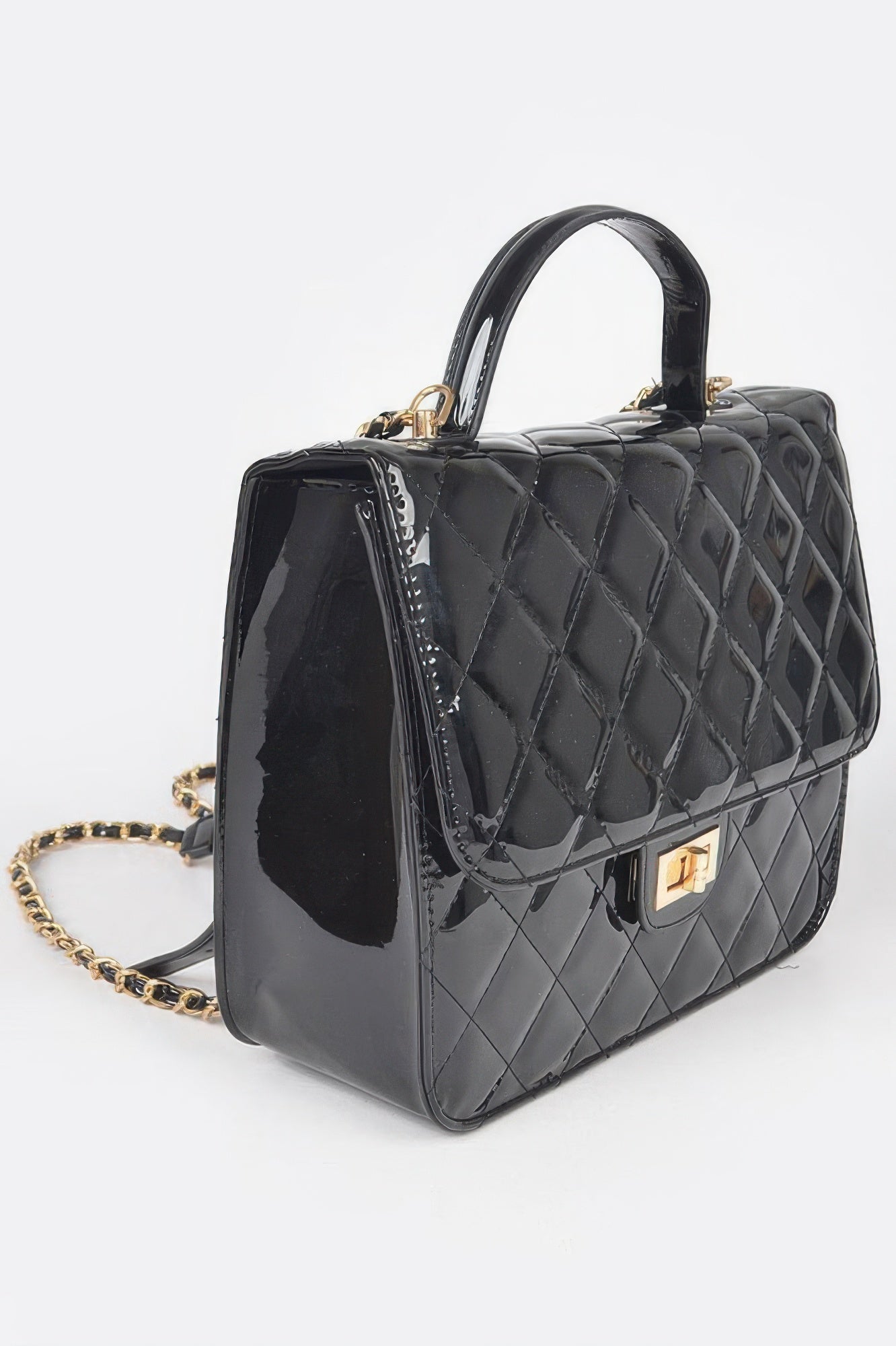 Black quilted enamel backpack with structured sides, gold hardware, chain shoulder strap