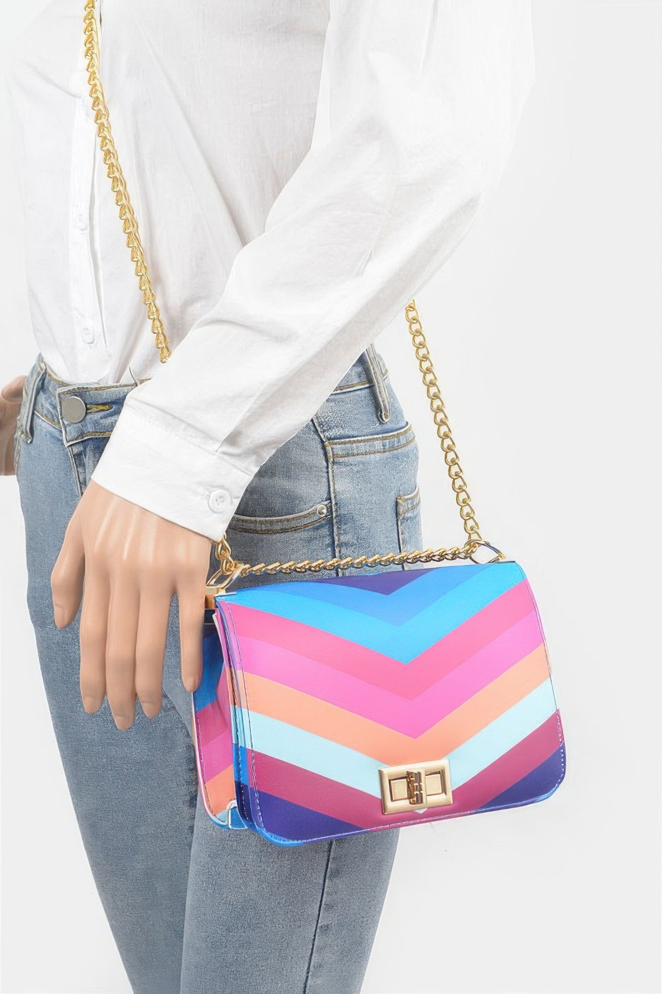 Multicolor chevron mini shoulder bag worn with gold chain strap