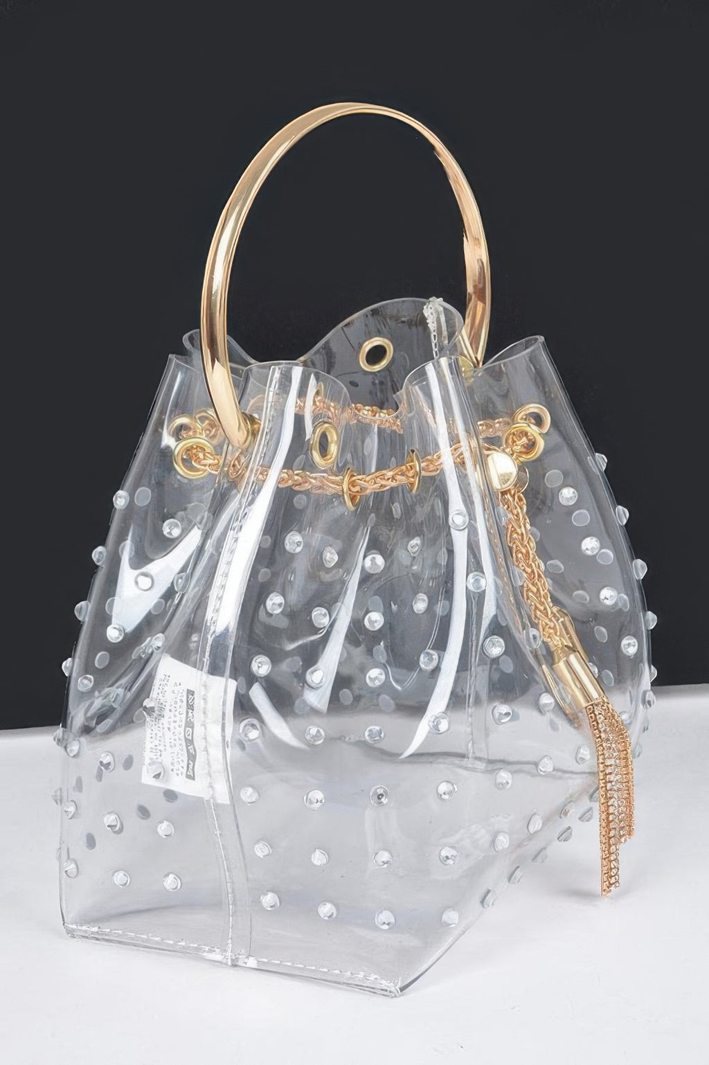 Faux pearl studded clear bucket bag with metal handle and long crossbody chain