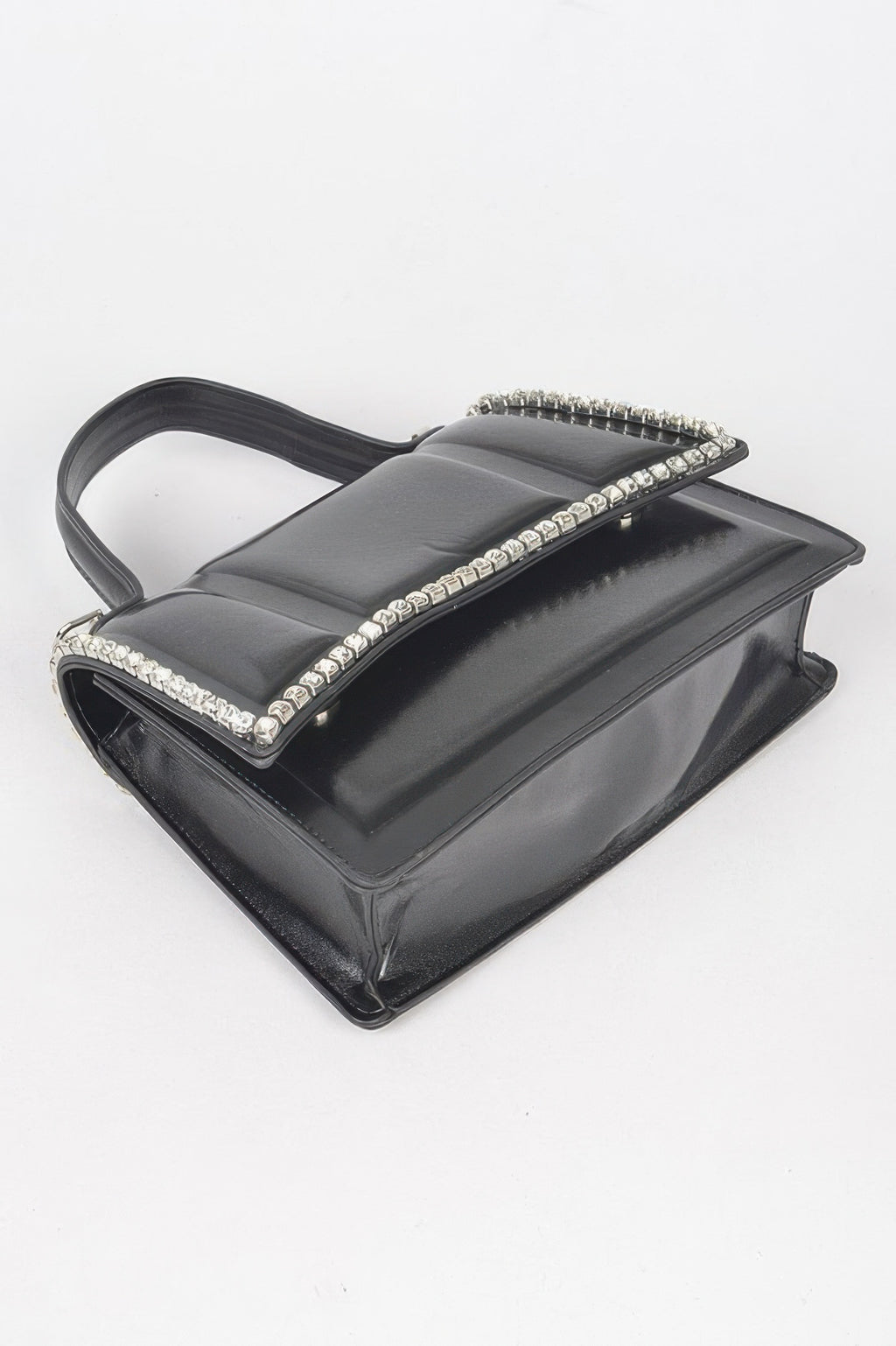 Black faux leather crossbody bag with rhinestone trim along the top handle
