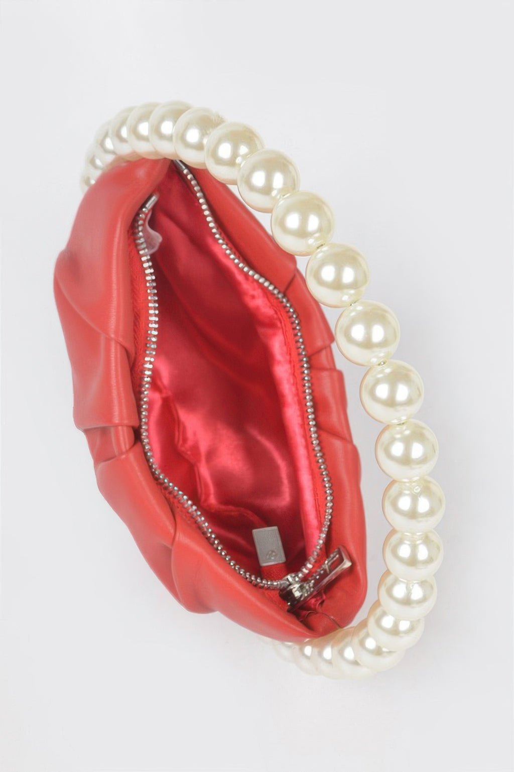 Red vegan metallic bag with faux pearl handle and zip detail with rhinestones