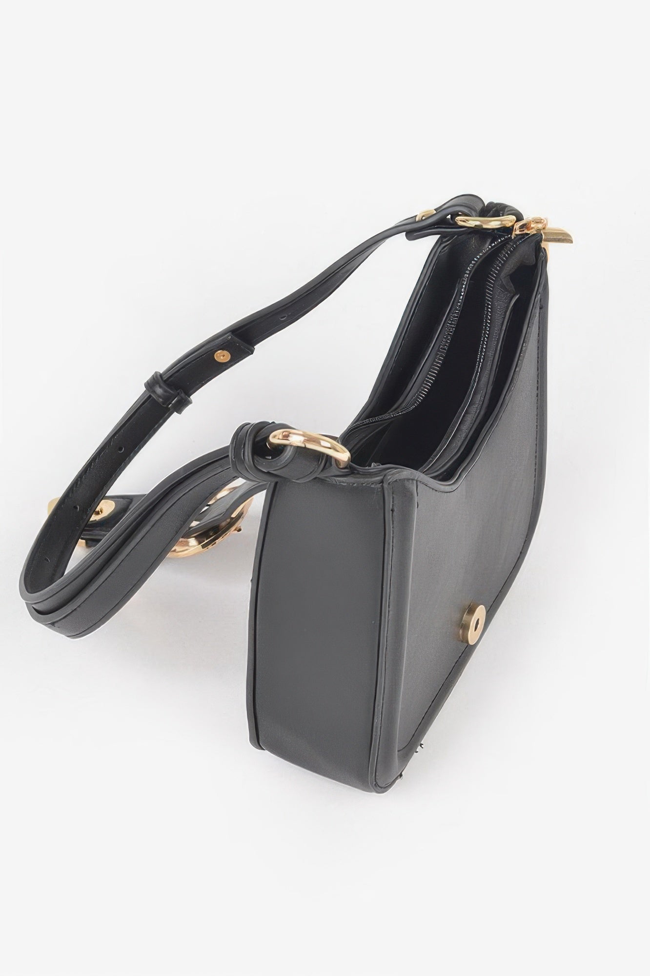 Black vegan shoulder bag with zipper interior, gold-tone hardware, and curved handles