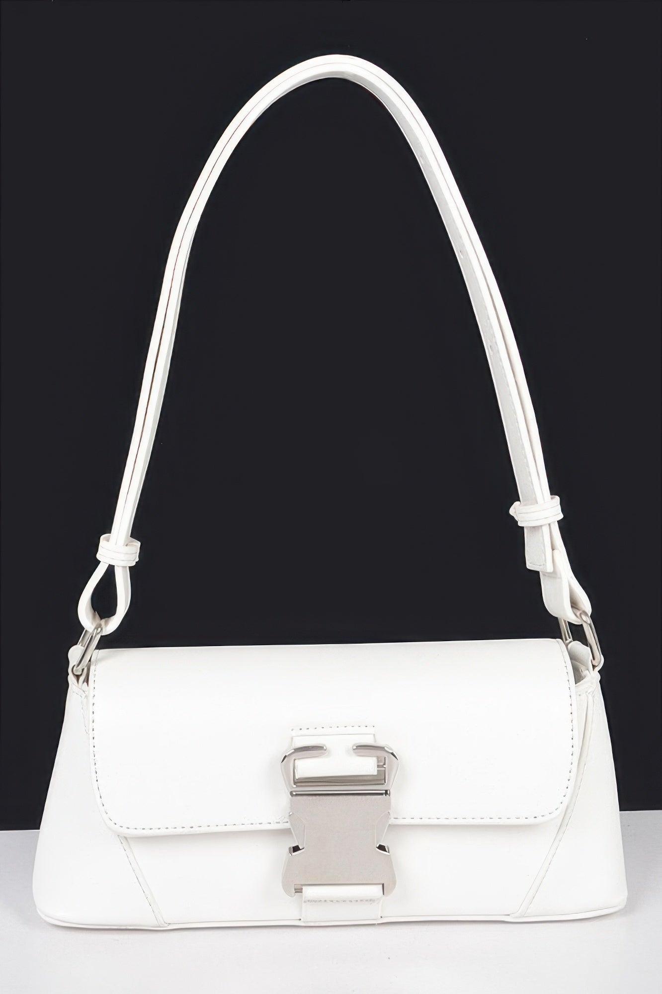 White faux leather shoulder bag, front flap with metal buckle and shoulder strap