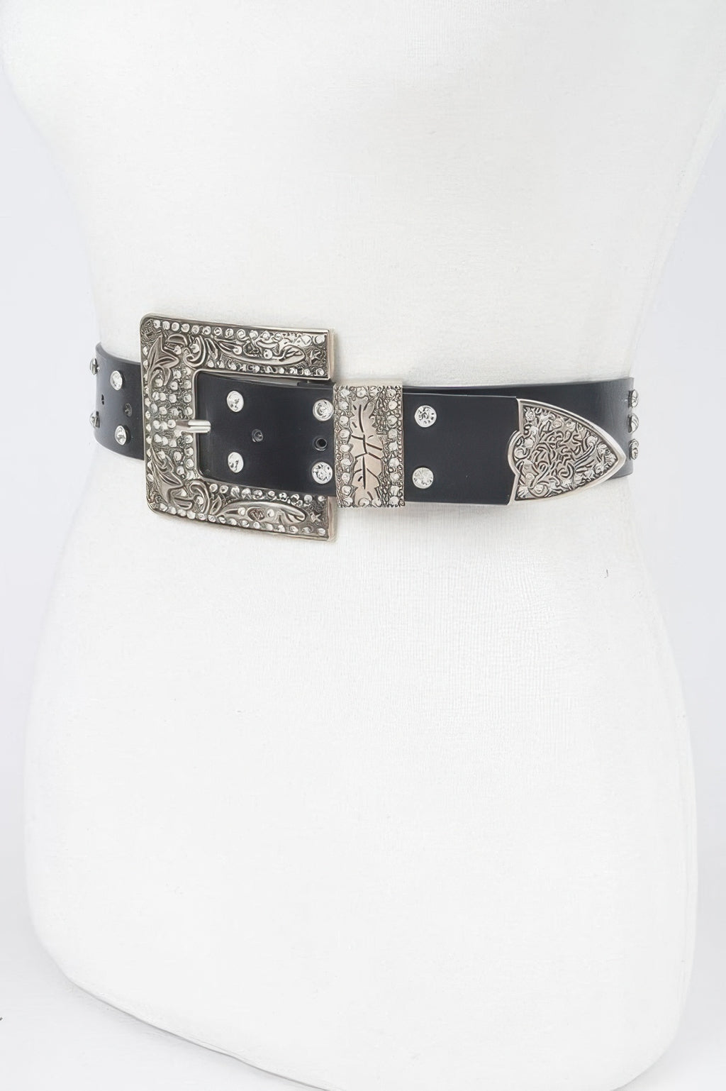 Black belt with ornate silver buckle, rhinestone studs, and pointed end.