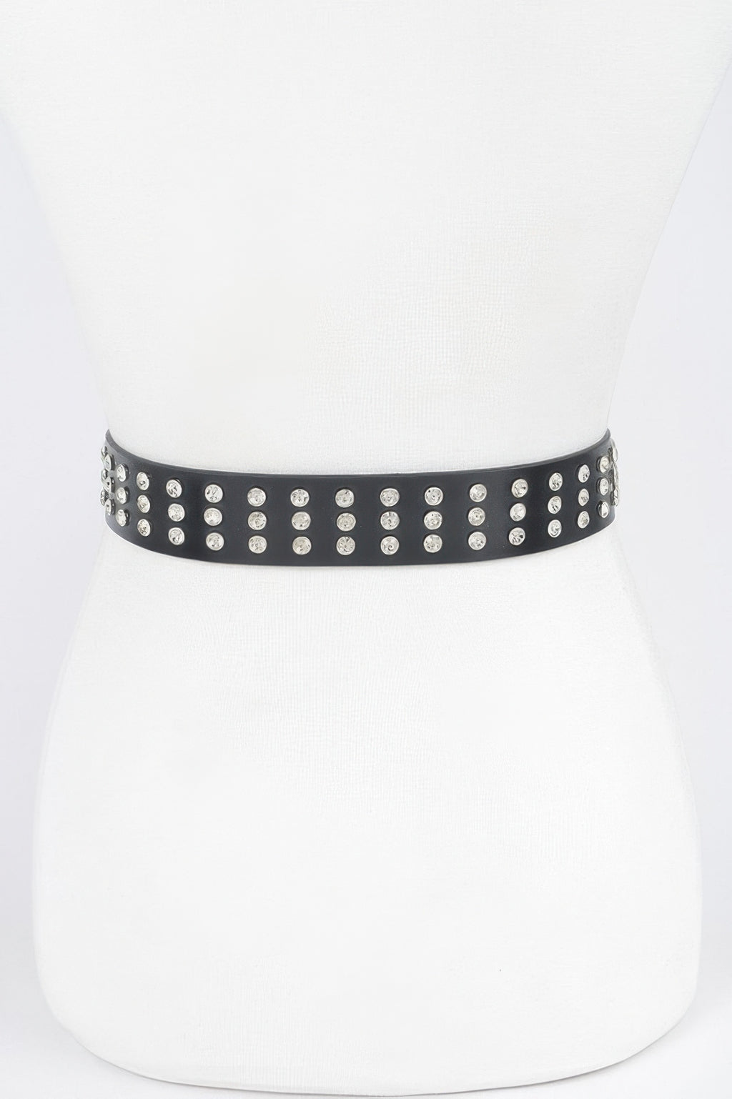 Black studded belt band with rows of round rhinestones, no buckle shown.