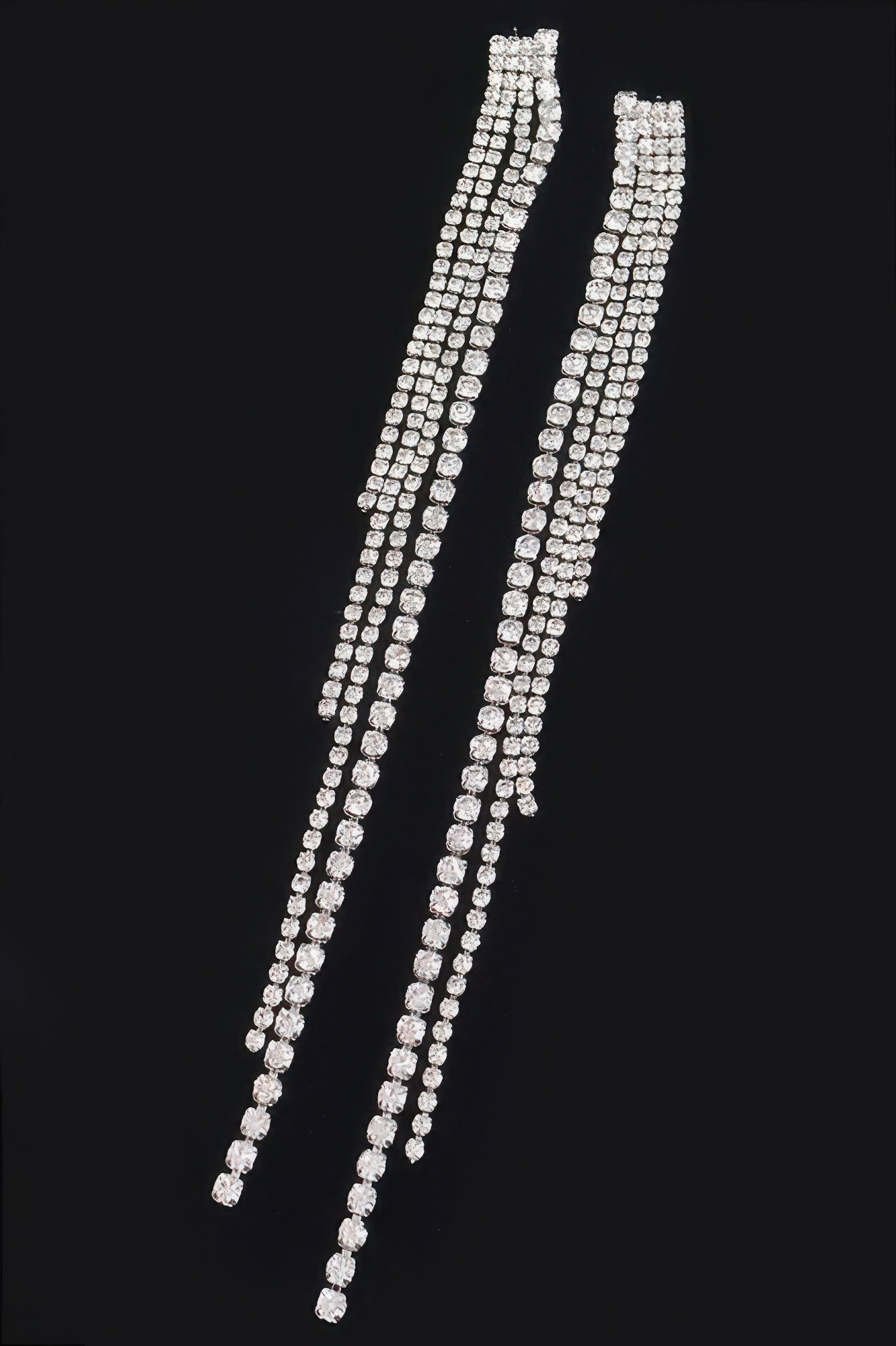 Long rhinestone drop earrings with multiple row settings, clear-silver finish