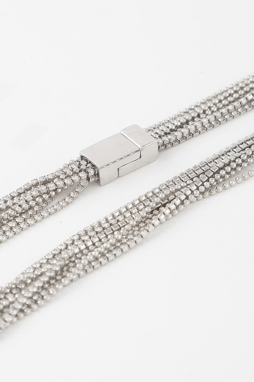 Rhinestone necklace clasp close-up with silver-toned bar and clear rows