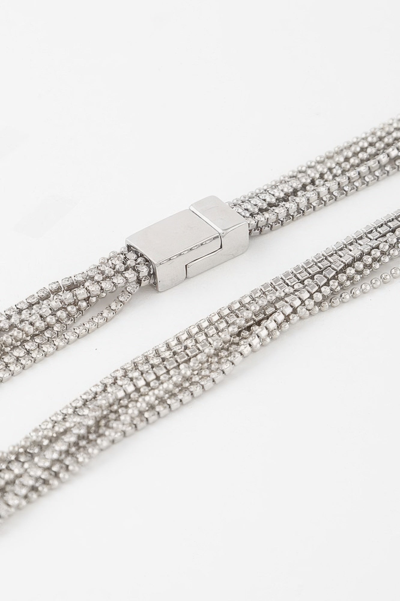 Rhinestone necklace clasp close-up with silver-toned bar and clear rows