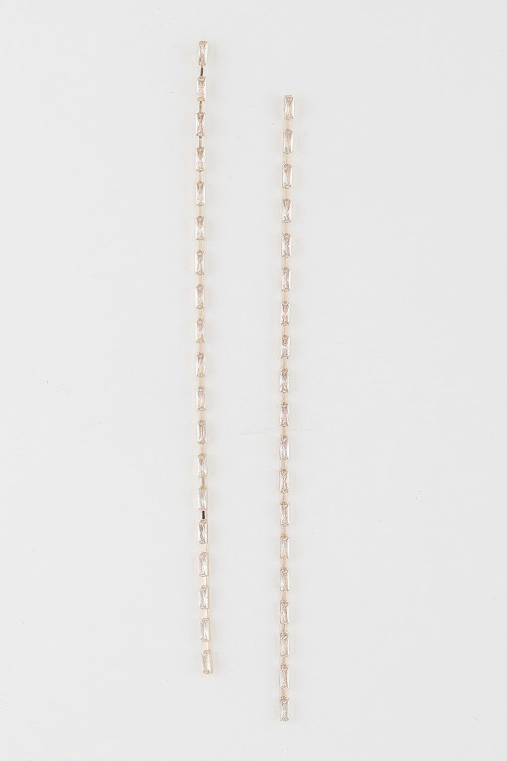 Crystal bar drop earrings in gold tone with clear rectangular crystals, long dangling bars
