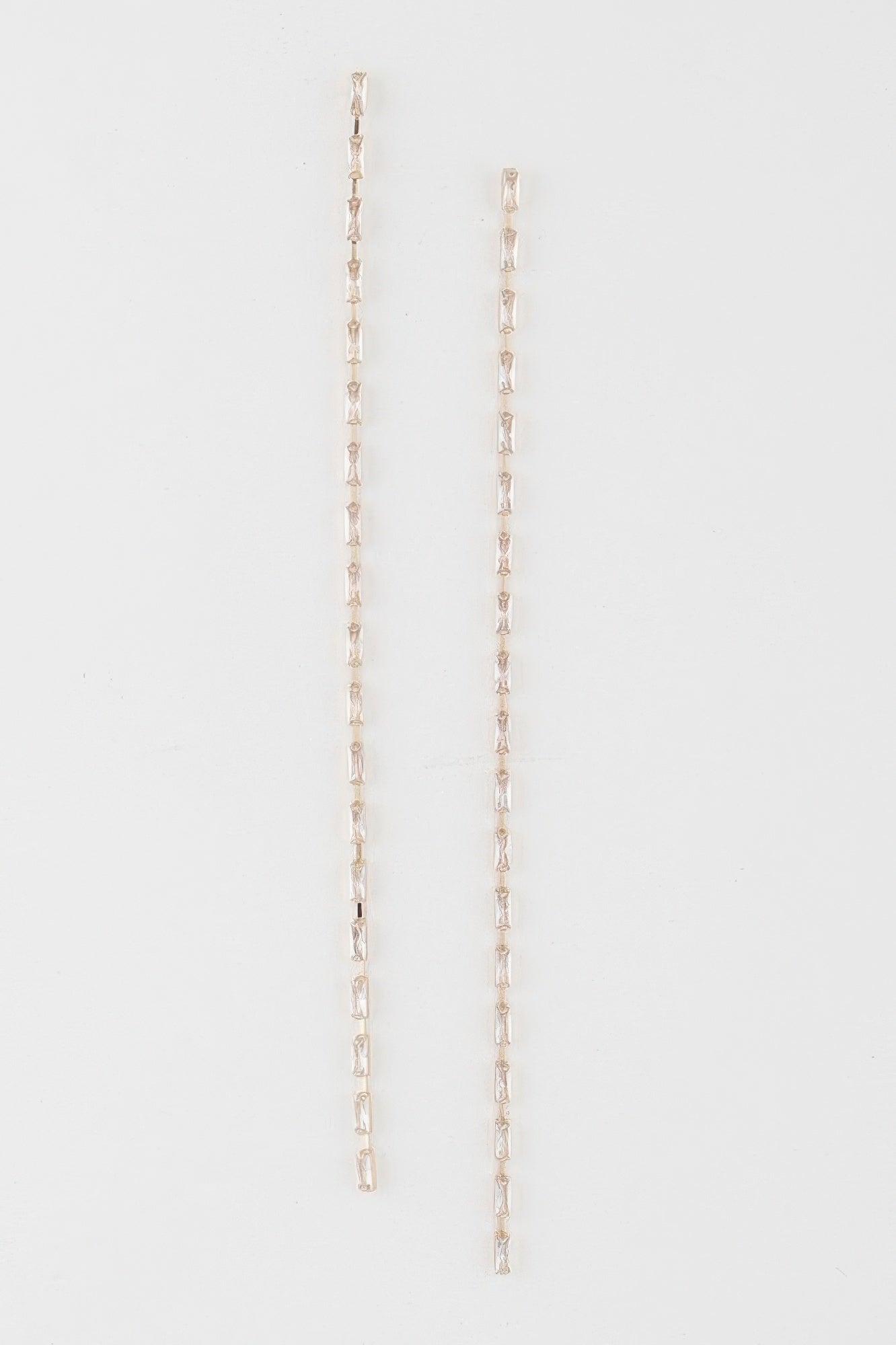 Crystal bar drop earrings in gold tone with clear rectangular crystals, long dangling bars