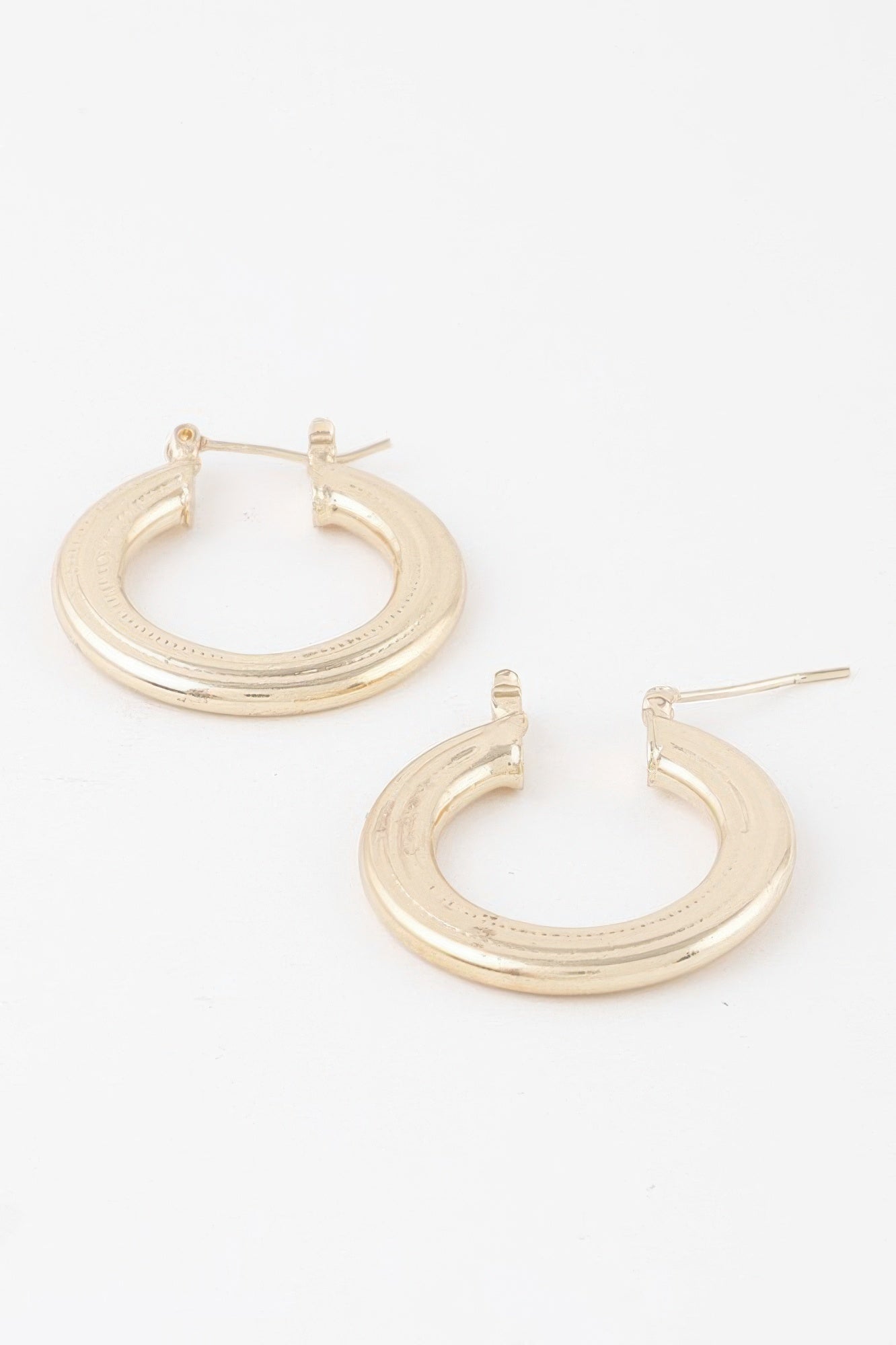 Minimal flat gold hoop earrings, front view with post and hinge back detail