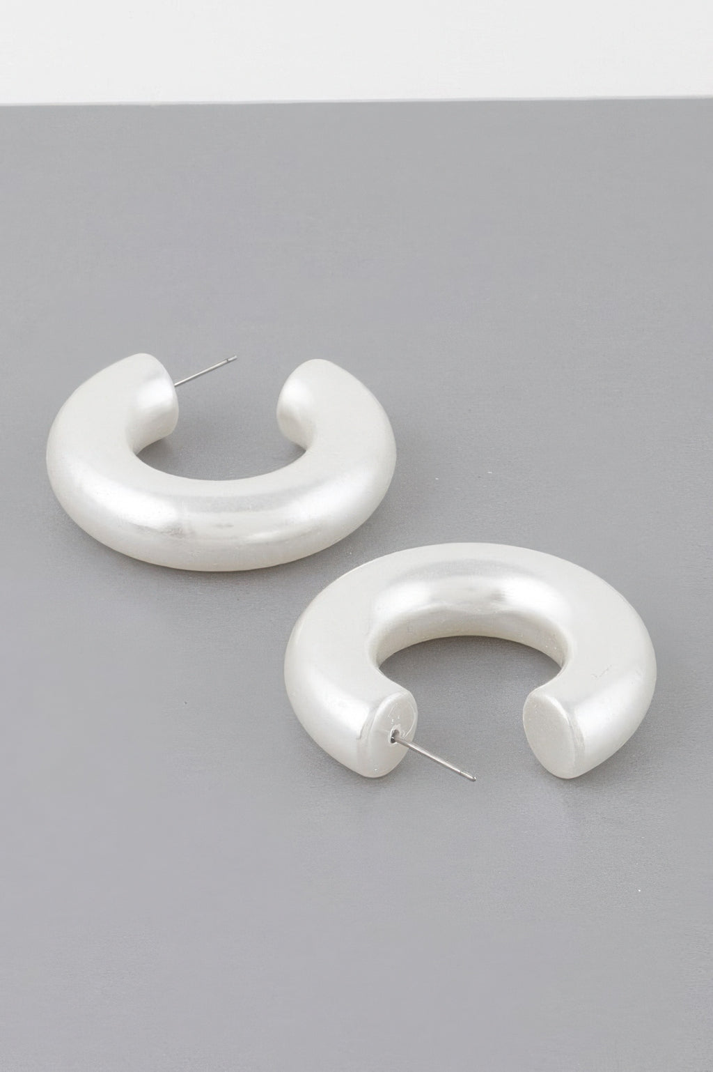 Cream chunky hoop earrings, glossy U-shape with stud back posts
