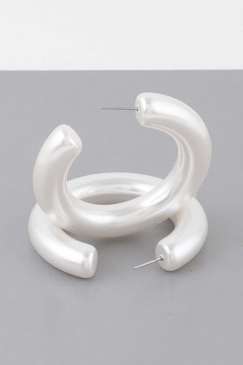 Polished cream statement hoop earrings, large hoops with stud posts visible
