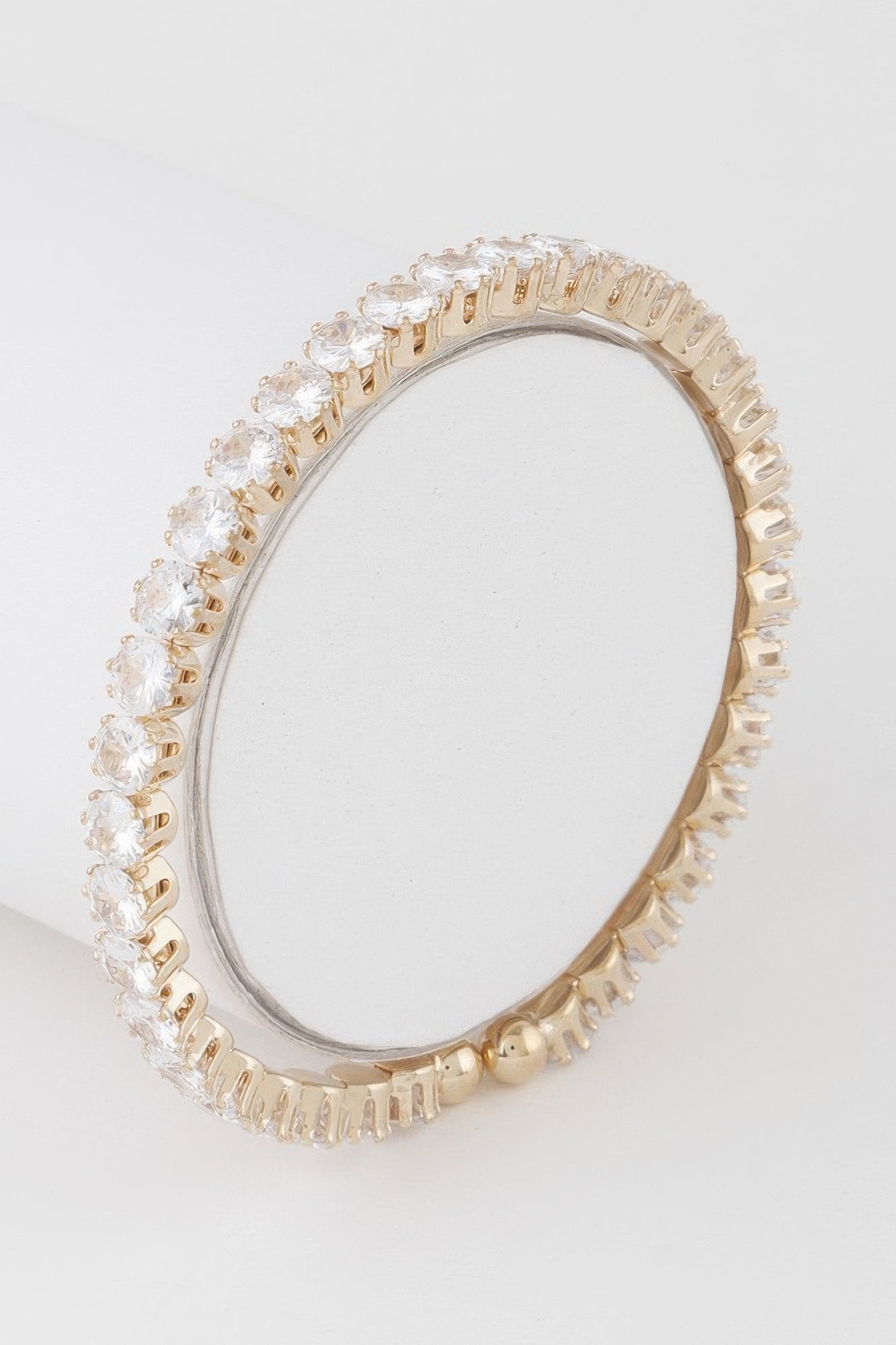 Rhinestone cuff bracelet, gold-tone with clear stones in a continuous circle