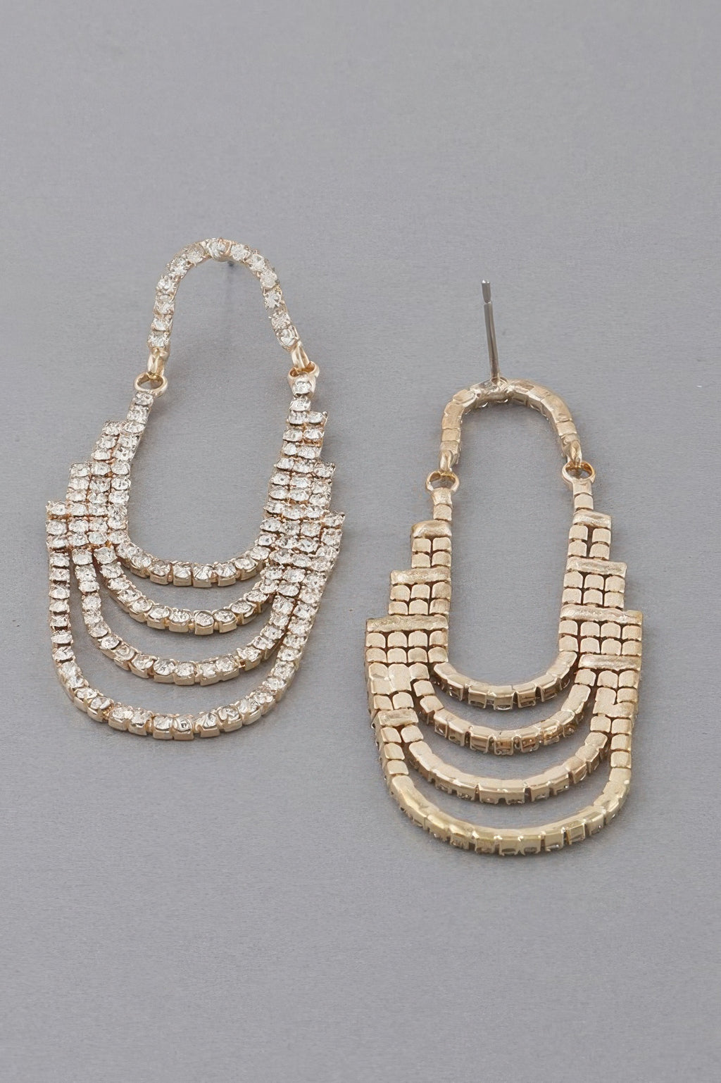 Gold-tone rhinestone drop earrings with post backs and stacked hoop-like rows