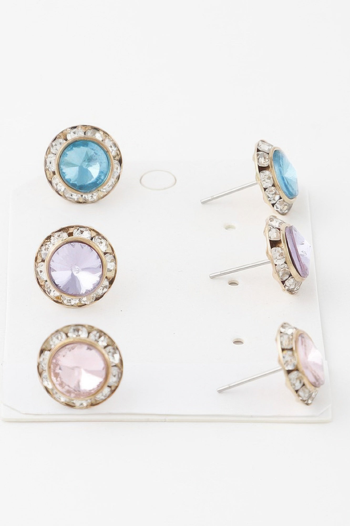 Multi Jeweled Stud Earrings set—round studs with light blue, lilac, and pink stones on display