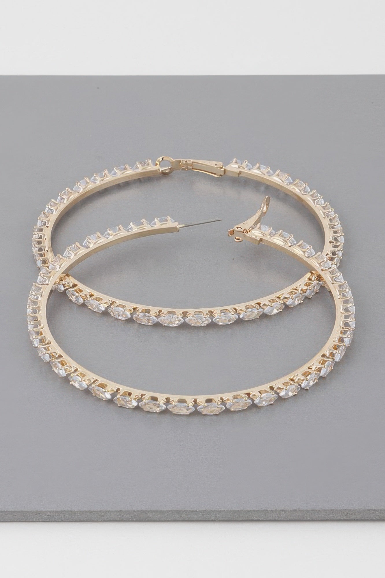 Teardrop jeweled hoop earrings, gold-tone with clear stones