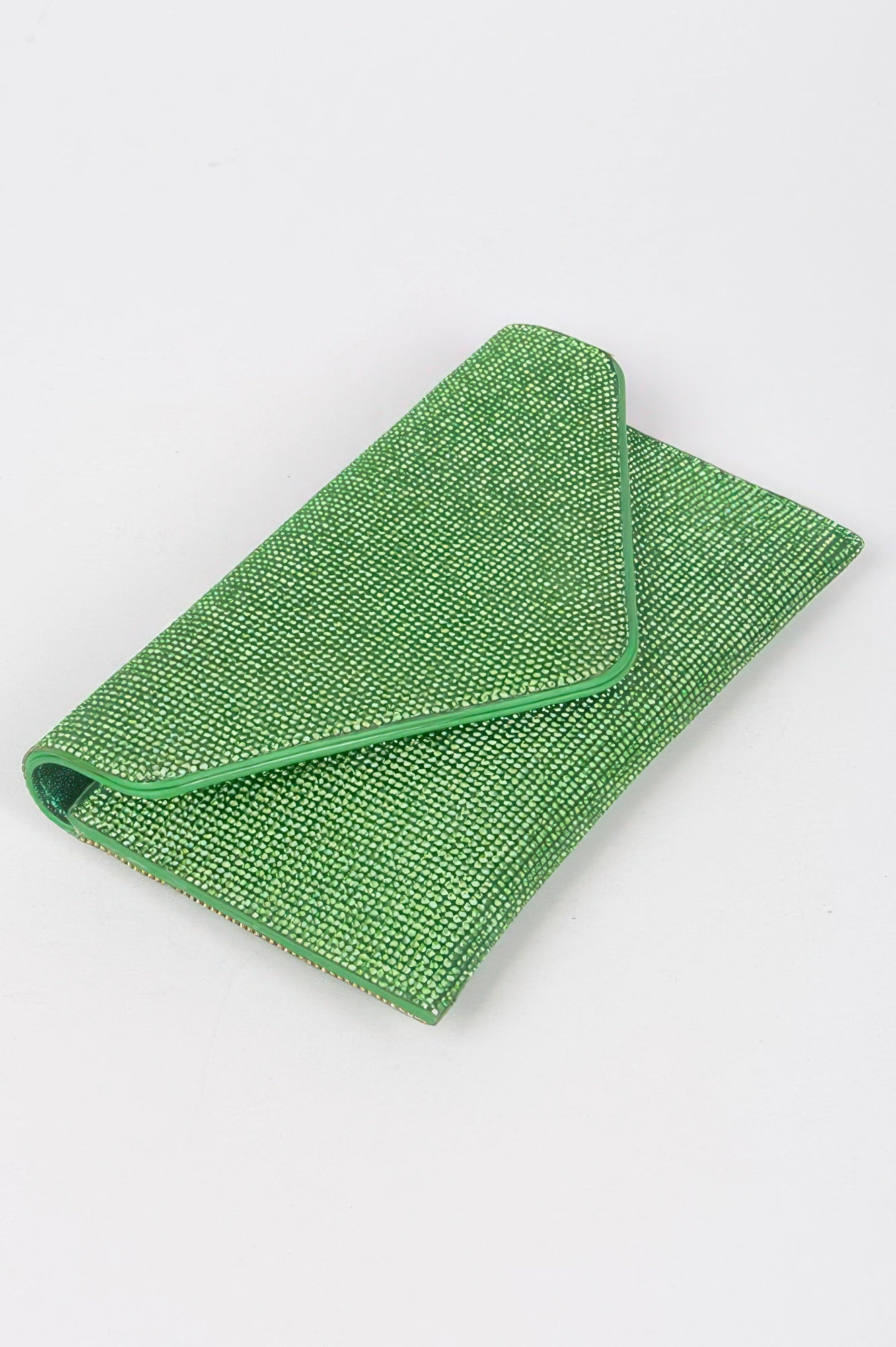 Green rhinestone envelope clutch laid flat with V-shaped fold