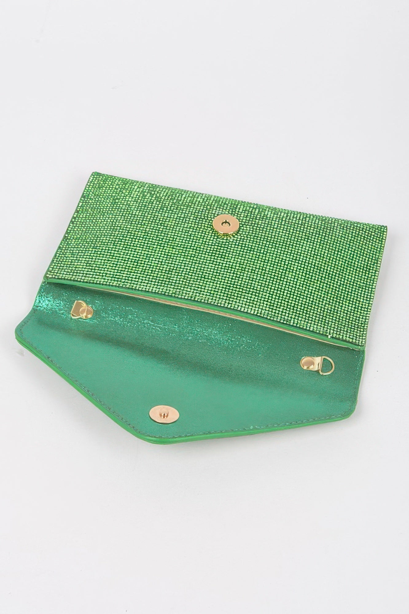Green interior of rhinestone envelope clutch with snap closures and lining