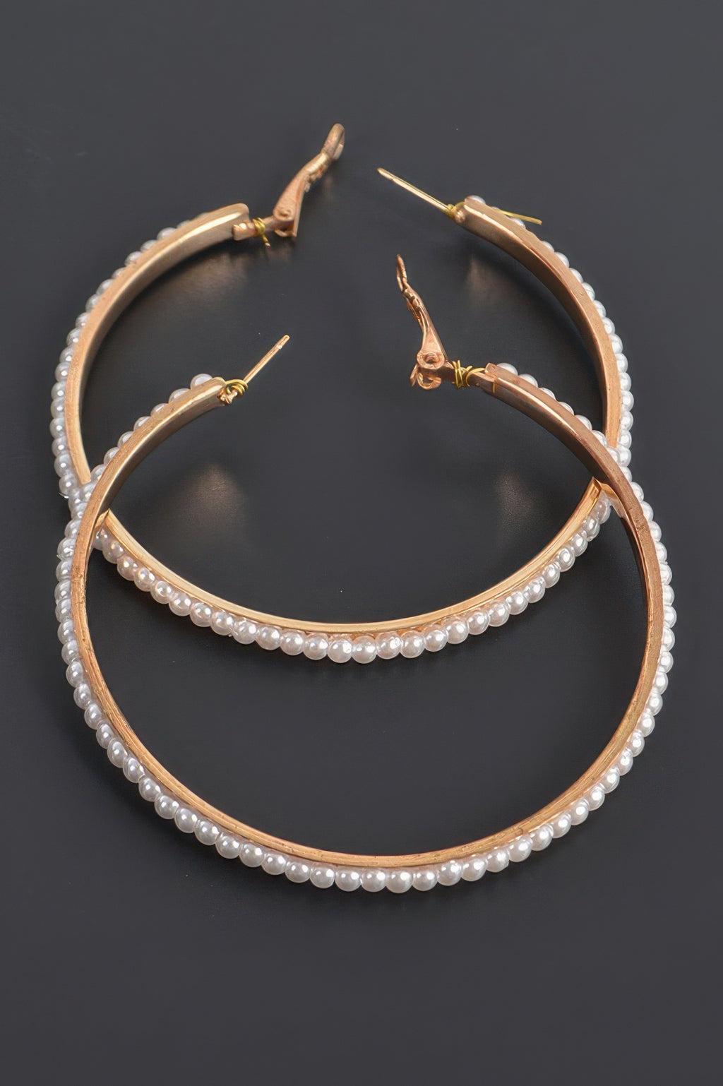 Round pearl hoop earrings with ivory pearl fringe on gold-tone hoops