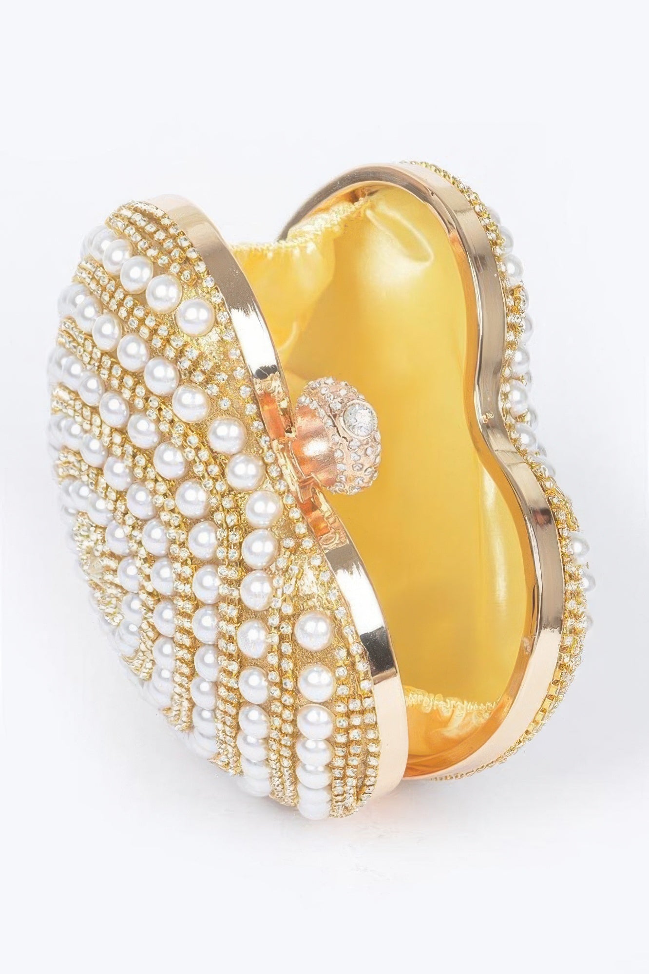 Gold heart clutch with glossy interior, pearl bead trim, and rhinestone top accent
