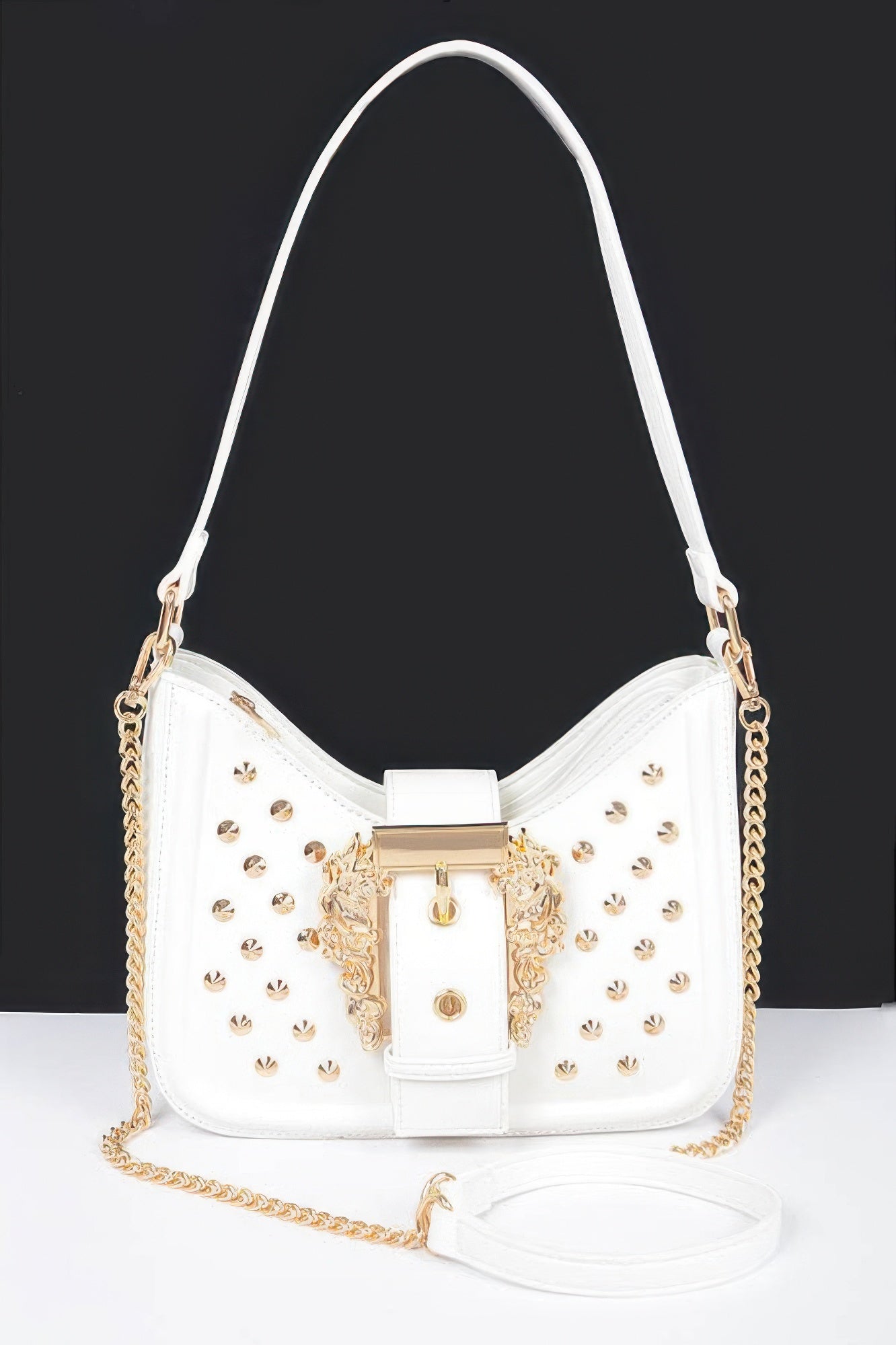 White faux leather studded shoulder bag with gold-tone buckle ornament and chain strap