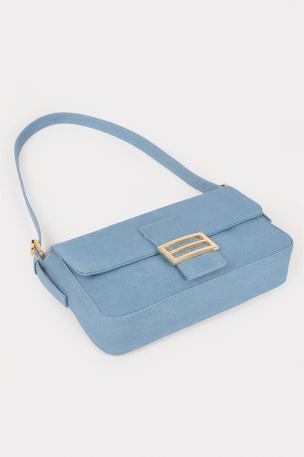Light blue denim shoulder bag with top flap and gold-tone buckle accent
