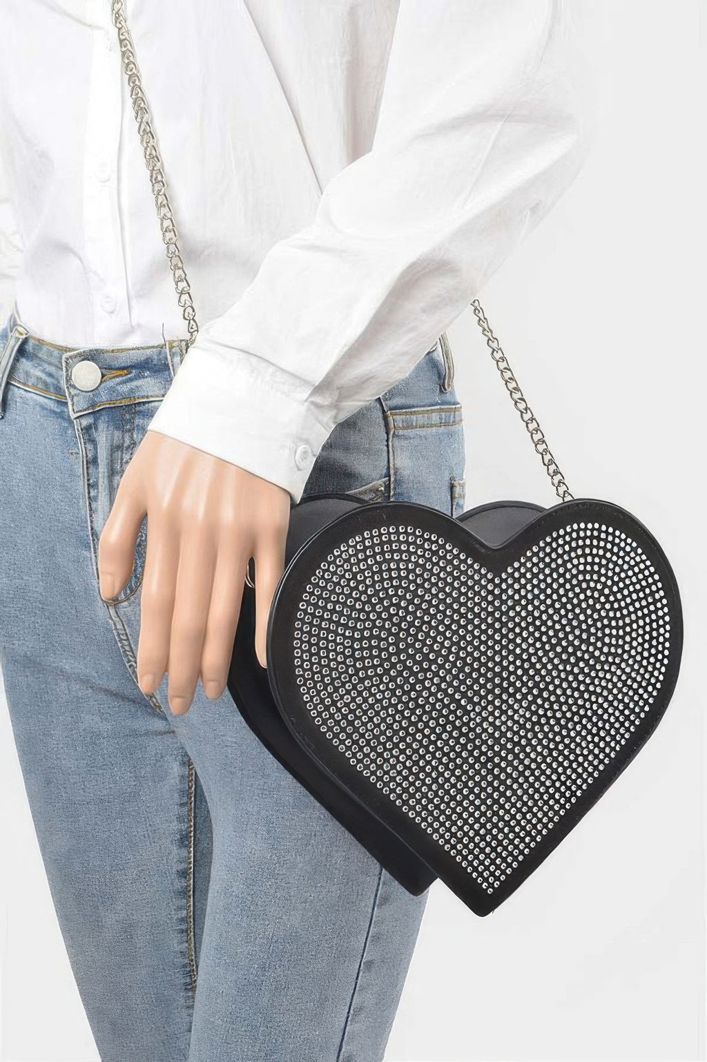 Black heart-shaped hot-fix bag with silver chain and studded rhinestone front.