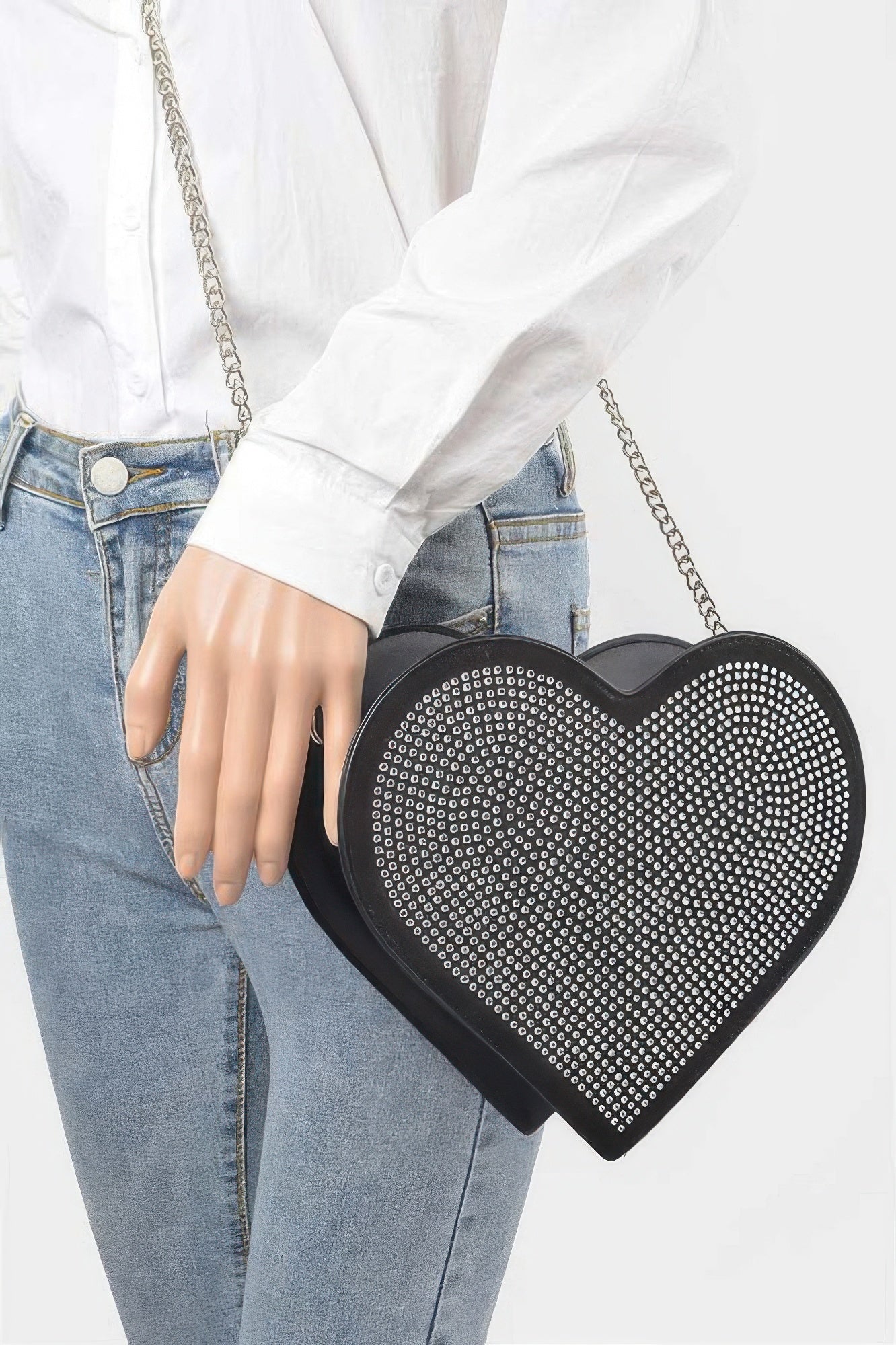 Black heart-shaped hot-fix bag with silver chain and studded rhinestone front.