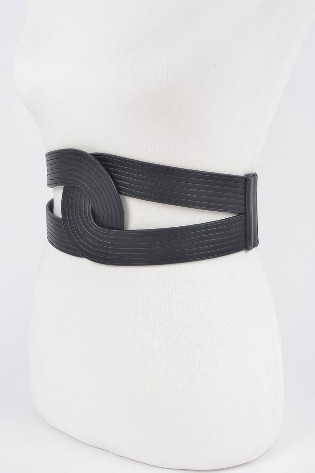 Black faux leather elastic belt with circular front detail and smooth elastic back strap.