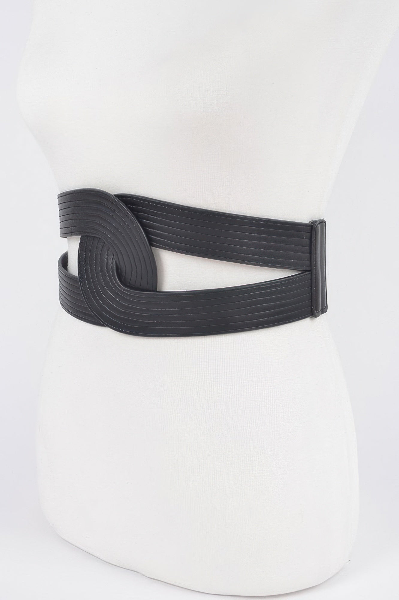 Black faux leather elastic belt with circular front detail and smooth elastic back strap.