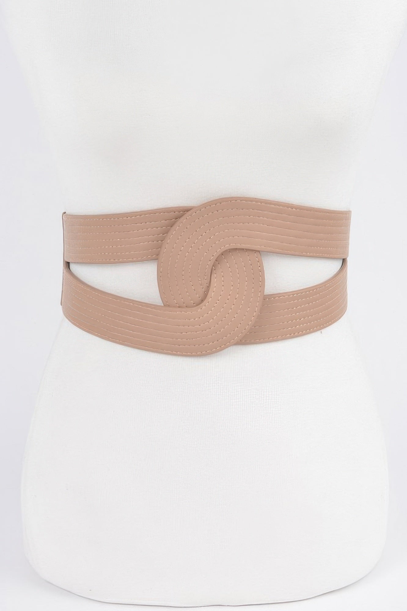Nude faux leather elastic belt with circular center buckle, textured band, one size.