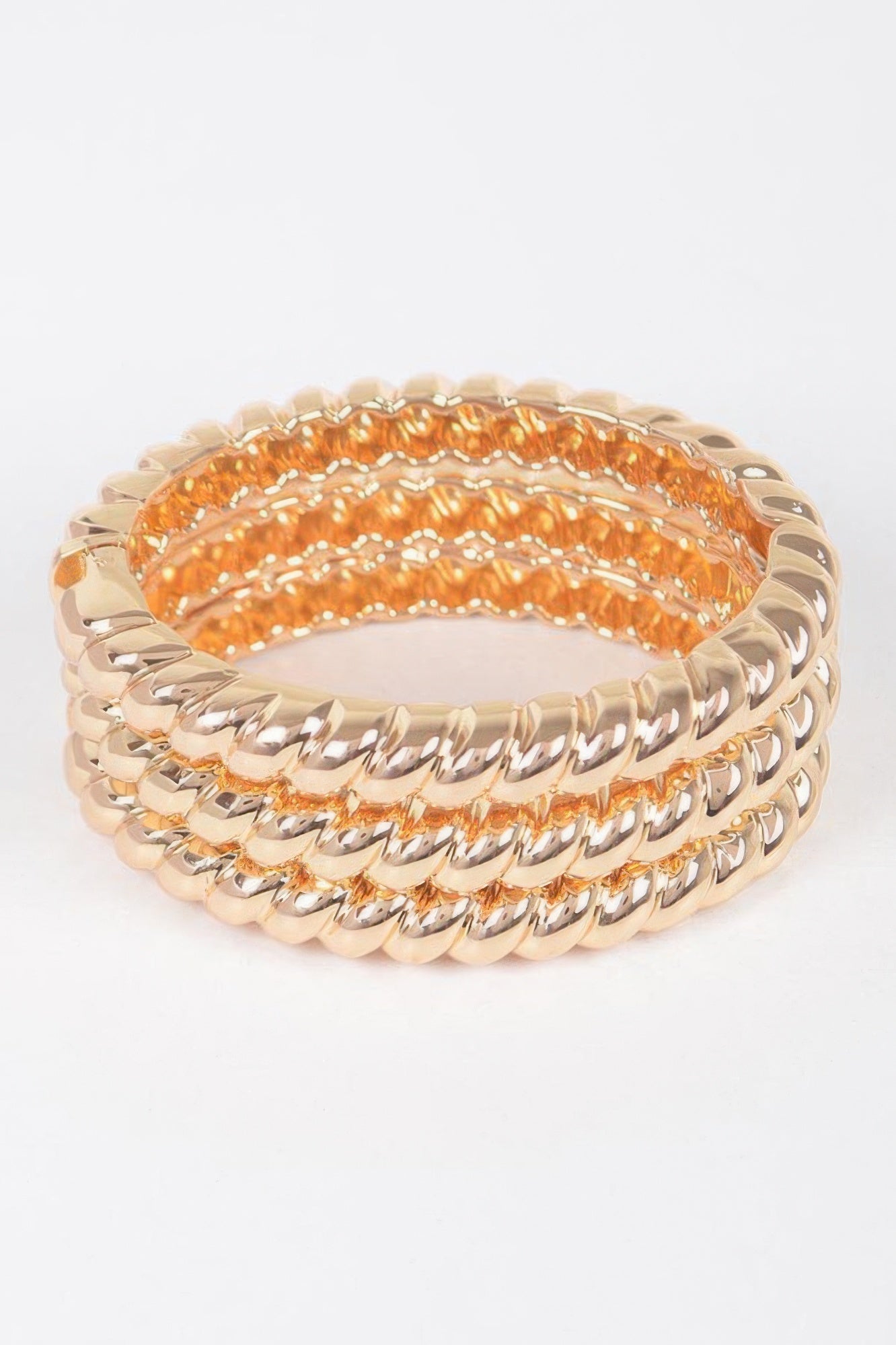 Three-piece metal bangle set, gold-tone bangles with orange inner inlay and oval links
