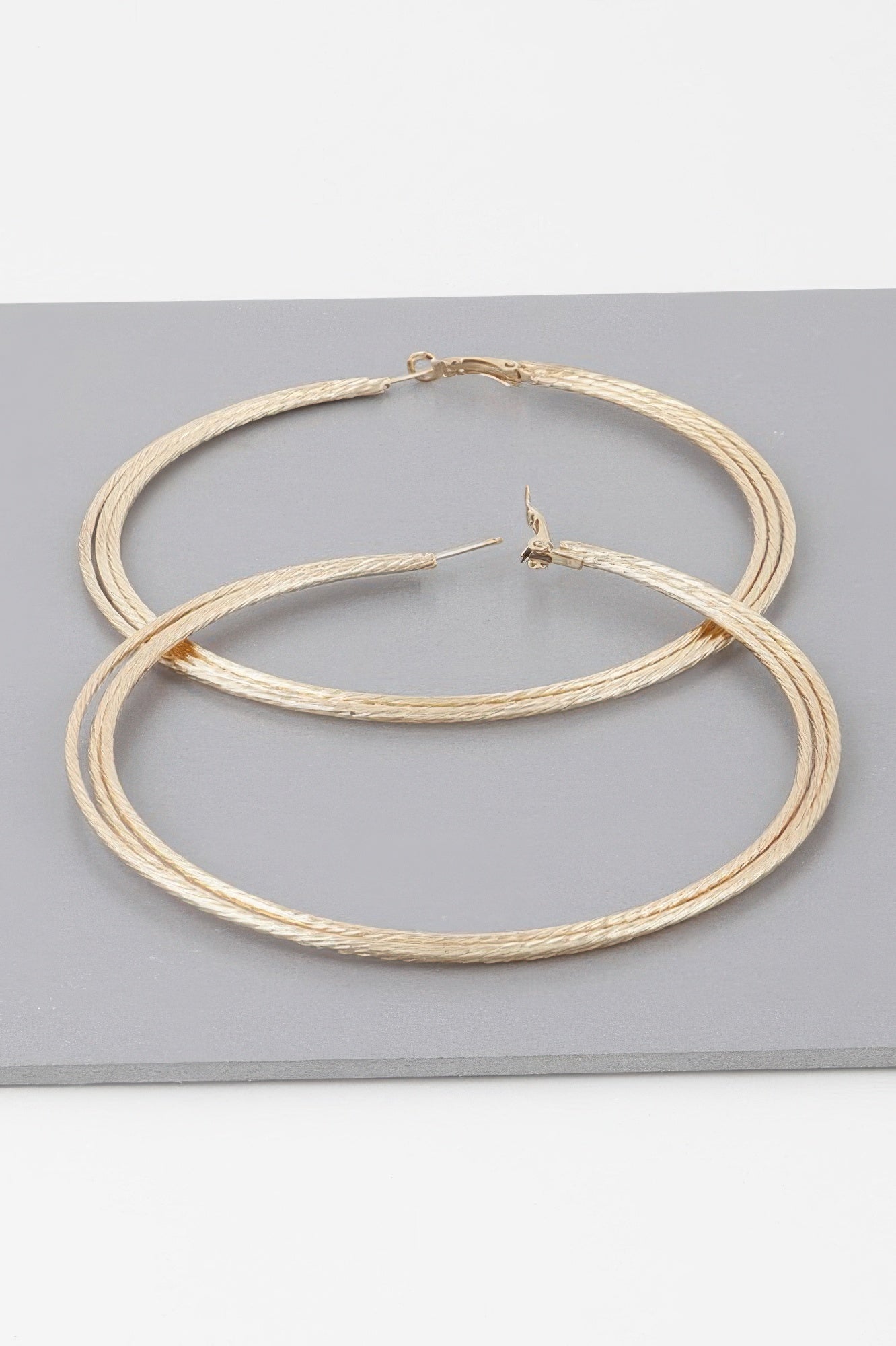 Wide Triple Rope Hoop Earrings, gold tone, two large intertwined hoops with clasp
