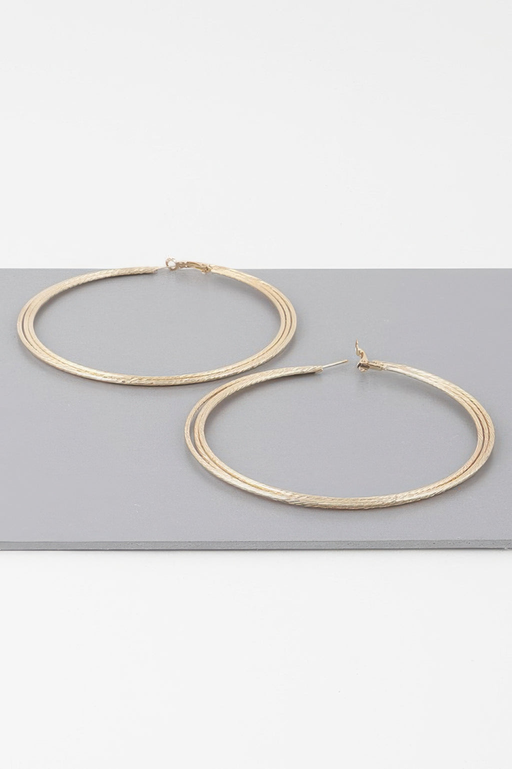 Gold wide triple rope hoop earrings with post back, separate hoops shown