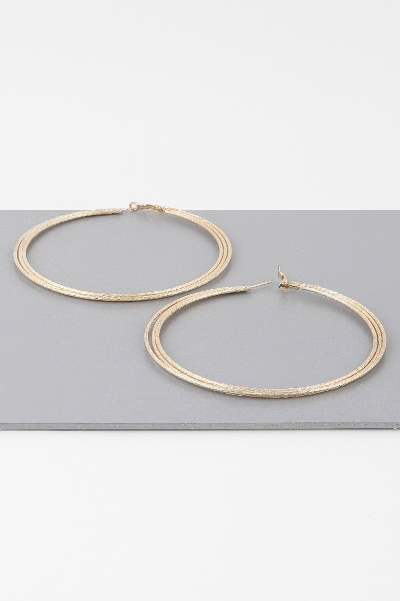 Gold wide triple rope hoop earrings with post back, separate hoops shown