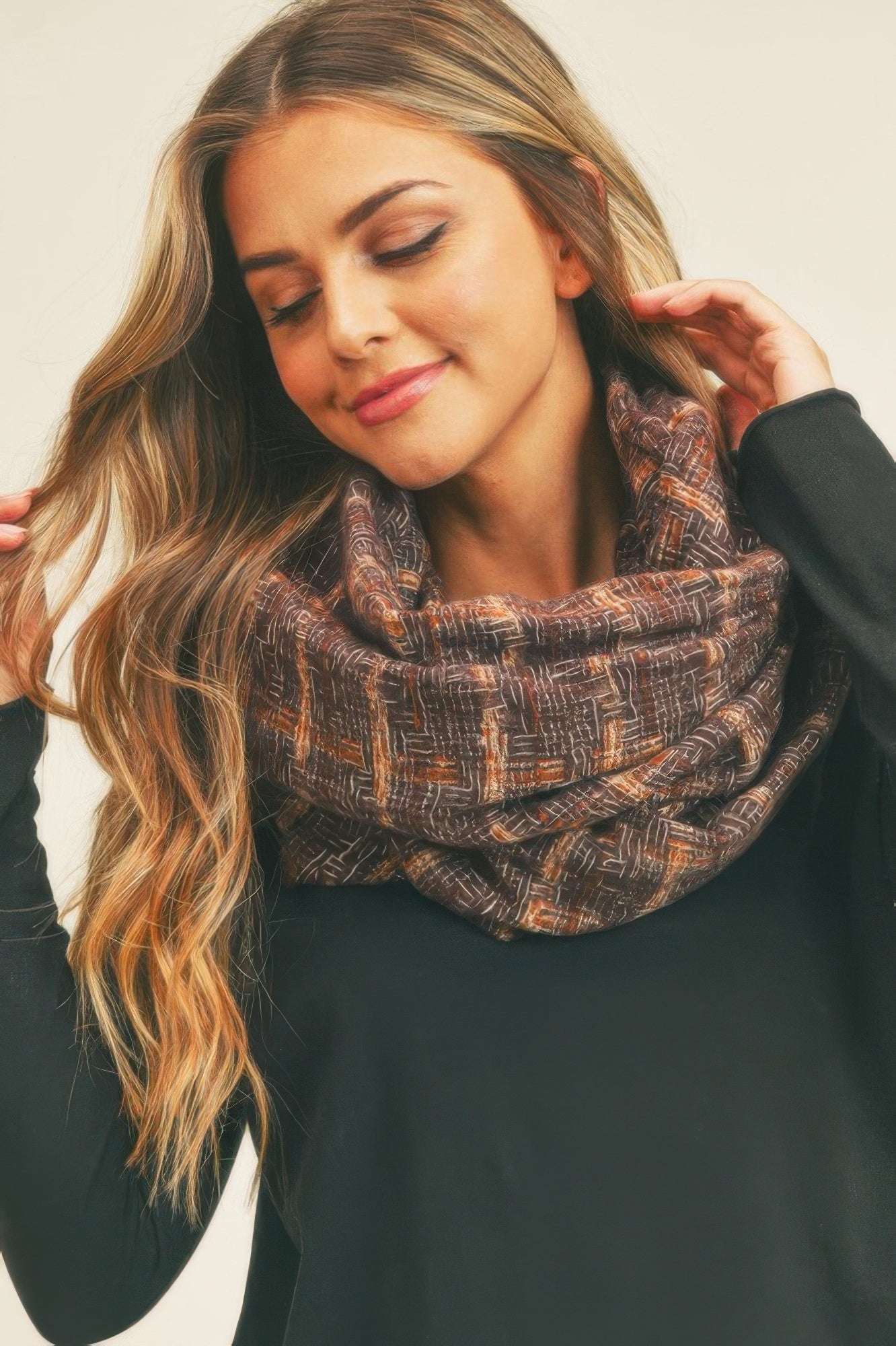 Brown plaid infinity scarf wrapped as a chunky cowl around neck
