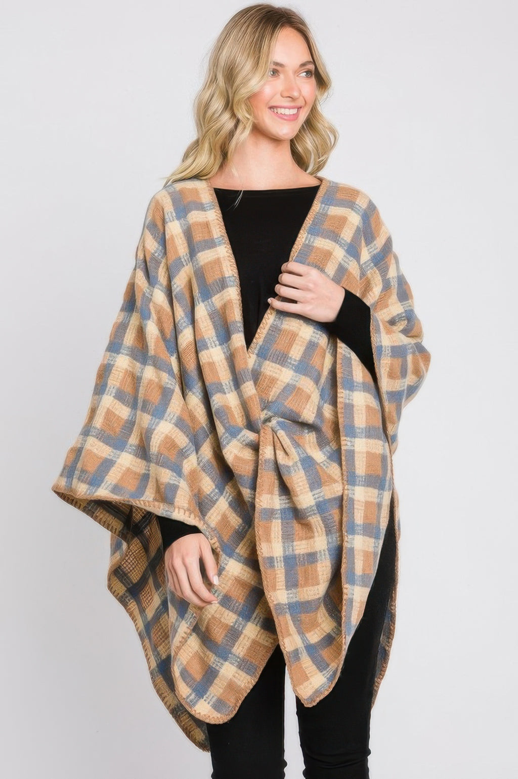 Plaid ruana with blue and taupe check pattern, one side draped