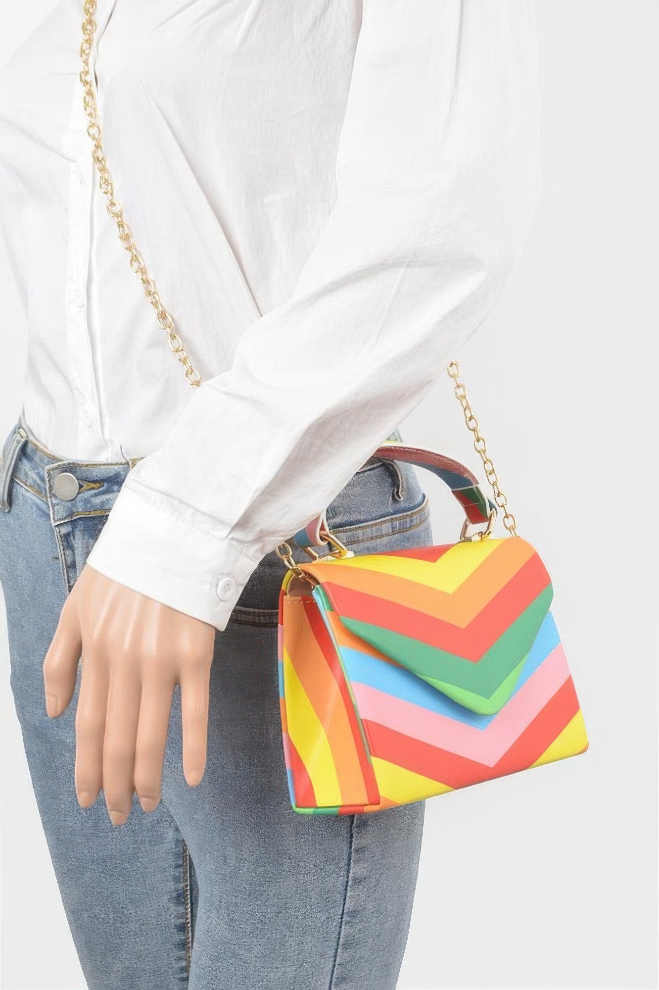 Worn on body: multicolor rainbow chevron clutch with gold chain strap