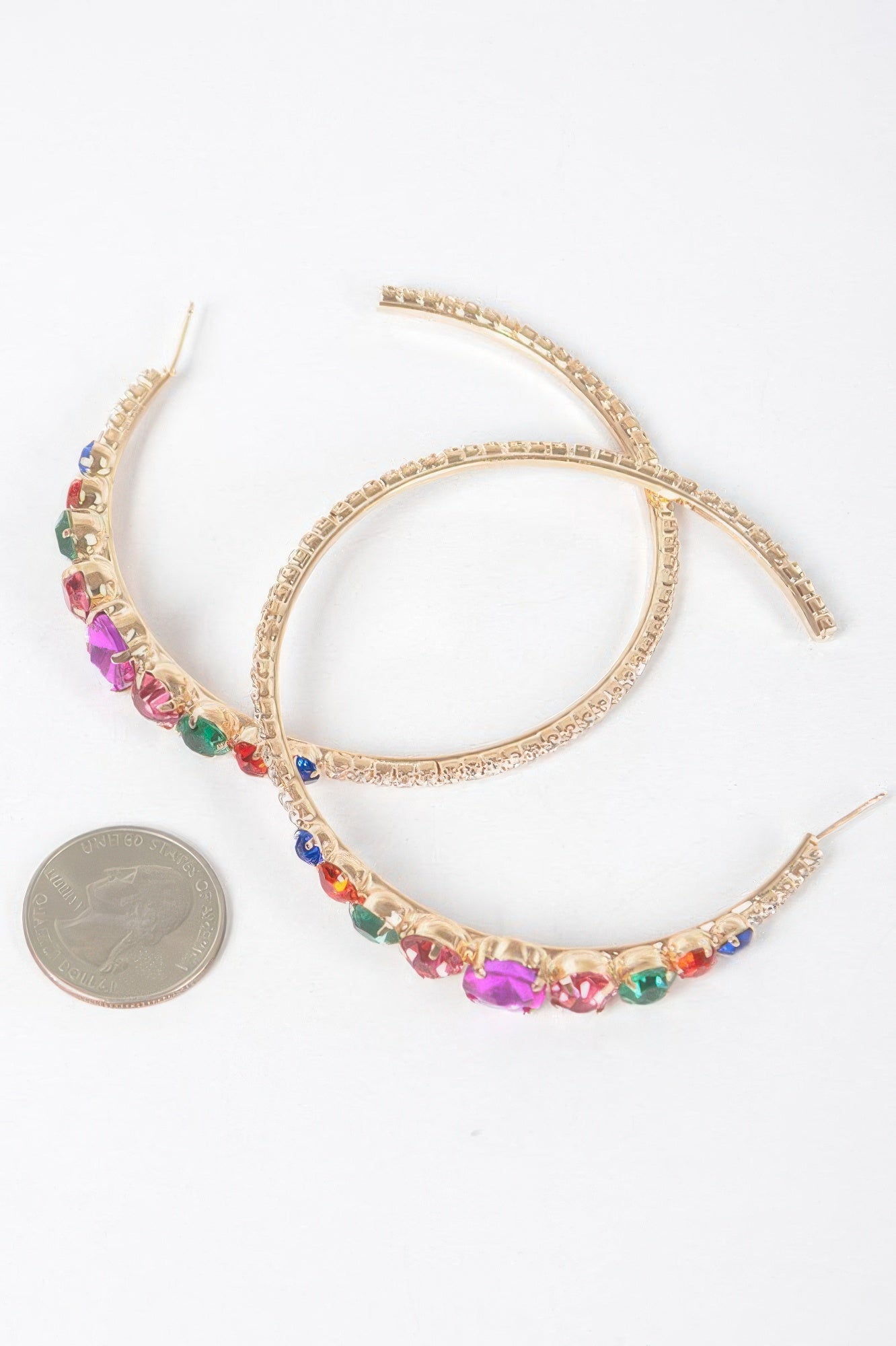 Rhinestone hoop earrings, gold-tone with multicolor crystals along the hoop