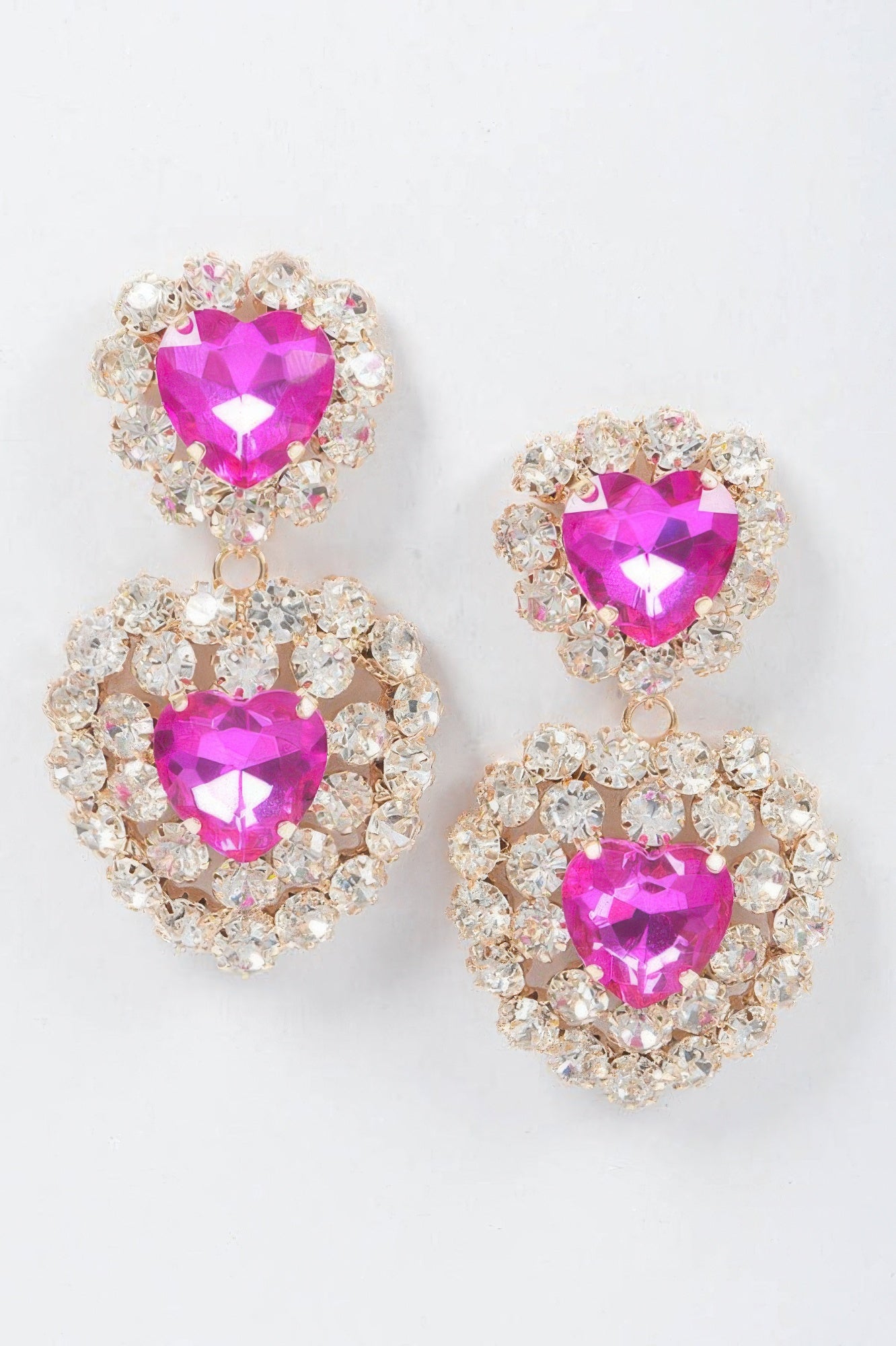 Heart stone earrings with fuchsia faceted heart centers and crystal halo drops