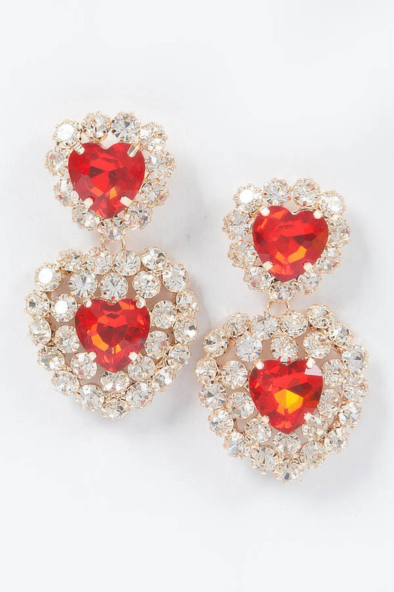 Heart stone earrings with red faceted heart centers and crystal halo dangles